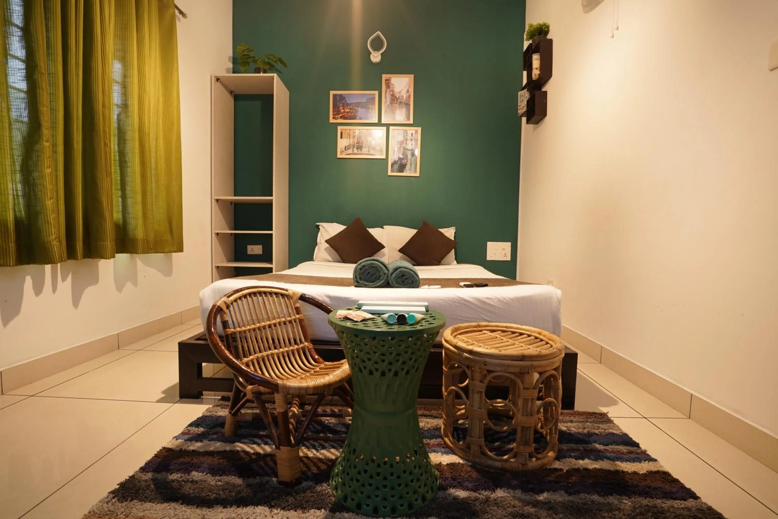 Seating area in Atmos Inn Calicut Near Aster Mims Hospital