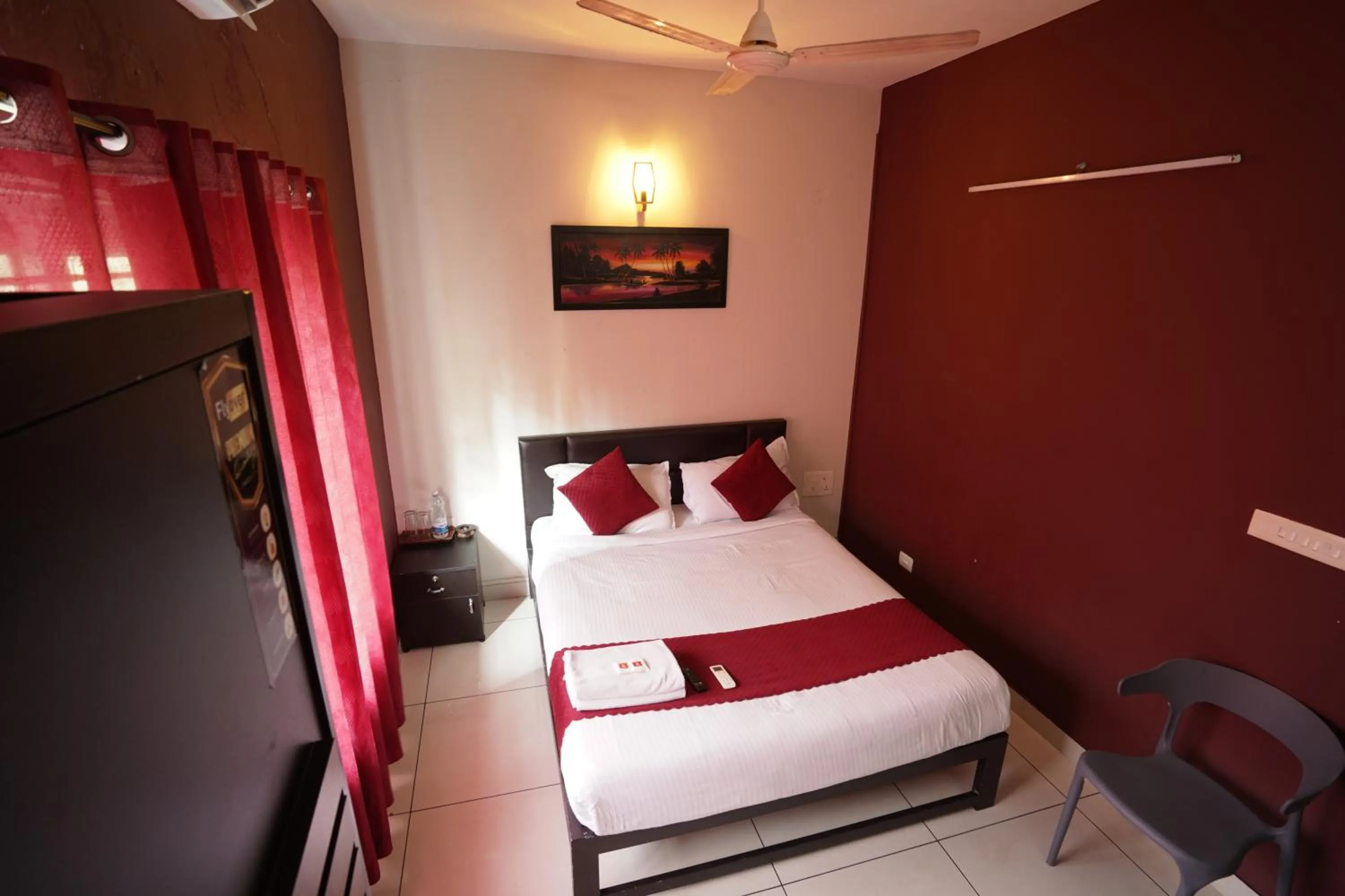 Bed in Atmos Inn Calicut Near Aster Mims Hospital