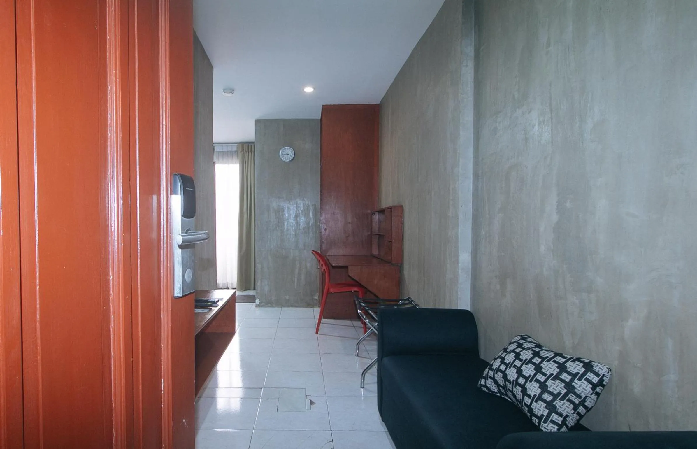 Seating area in Rcee Place by RedDoorz