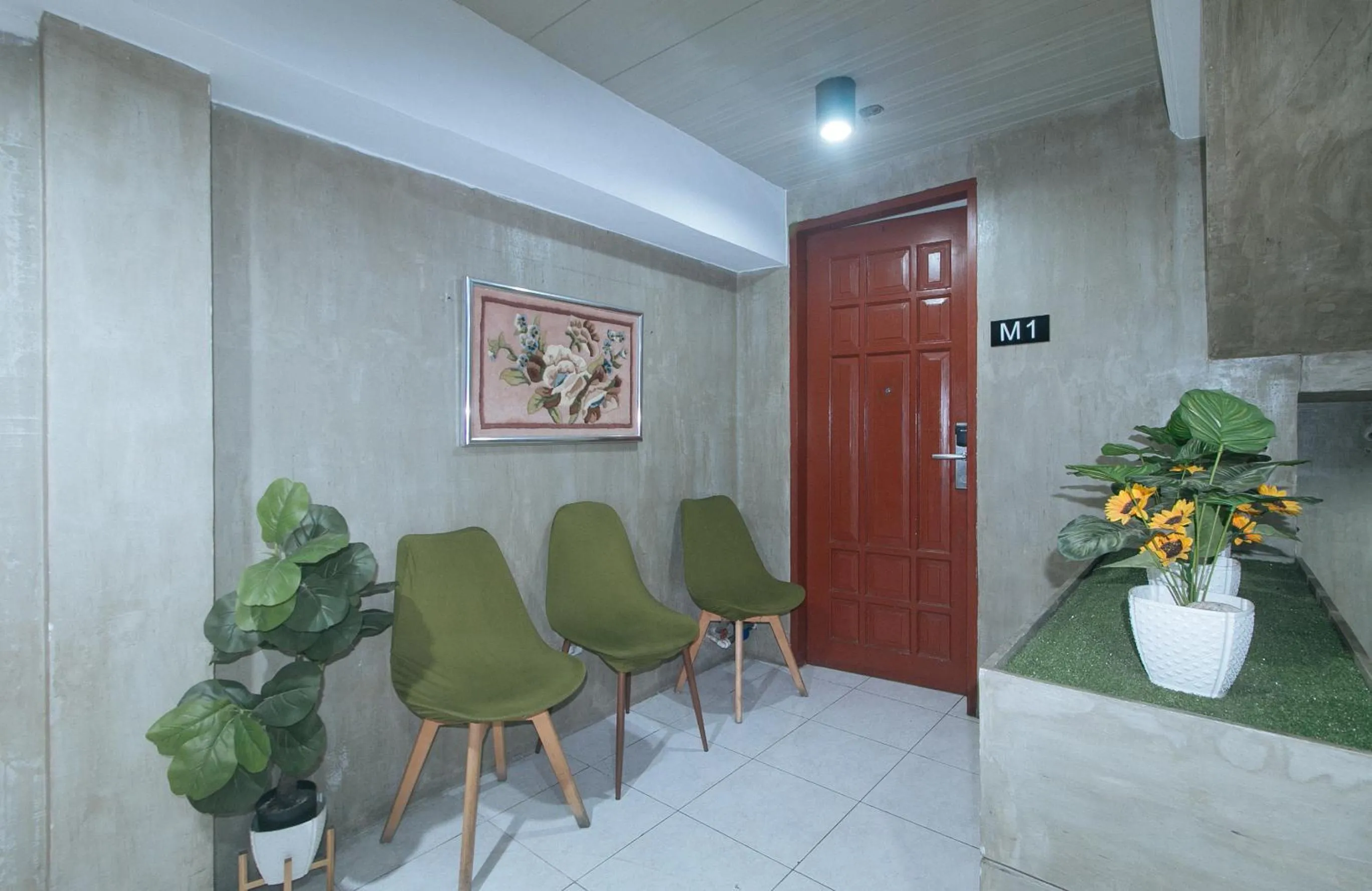 Seating area in Rcee Place by RedDoorz