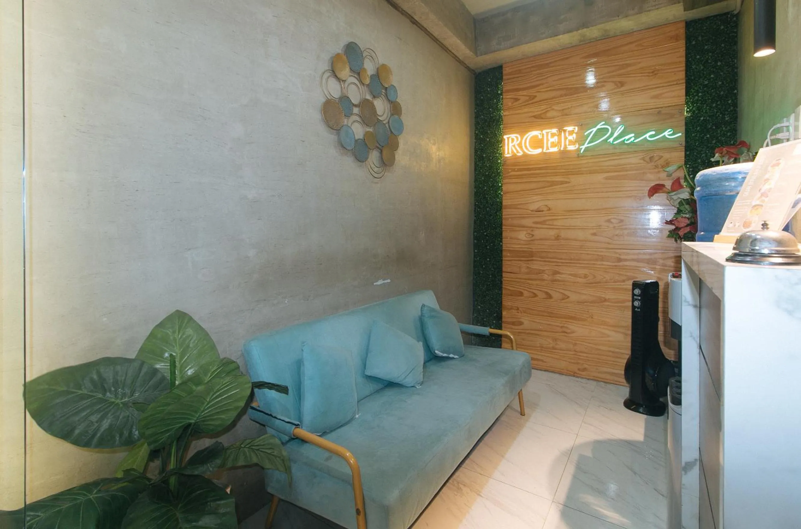 Seating area in Rcee Place by RedDoorz