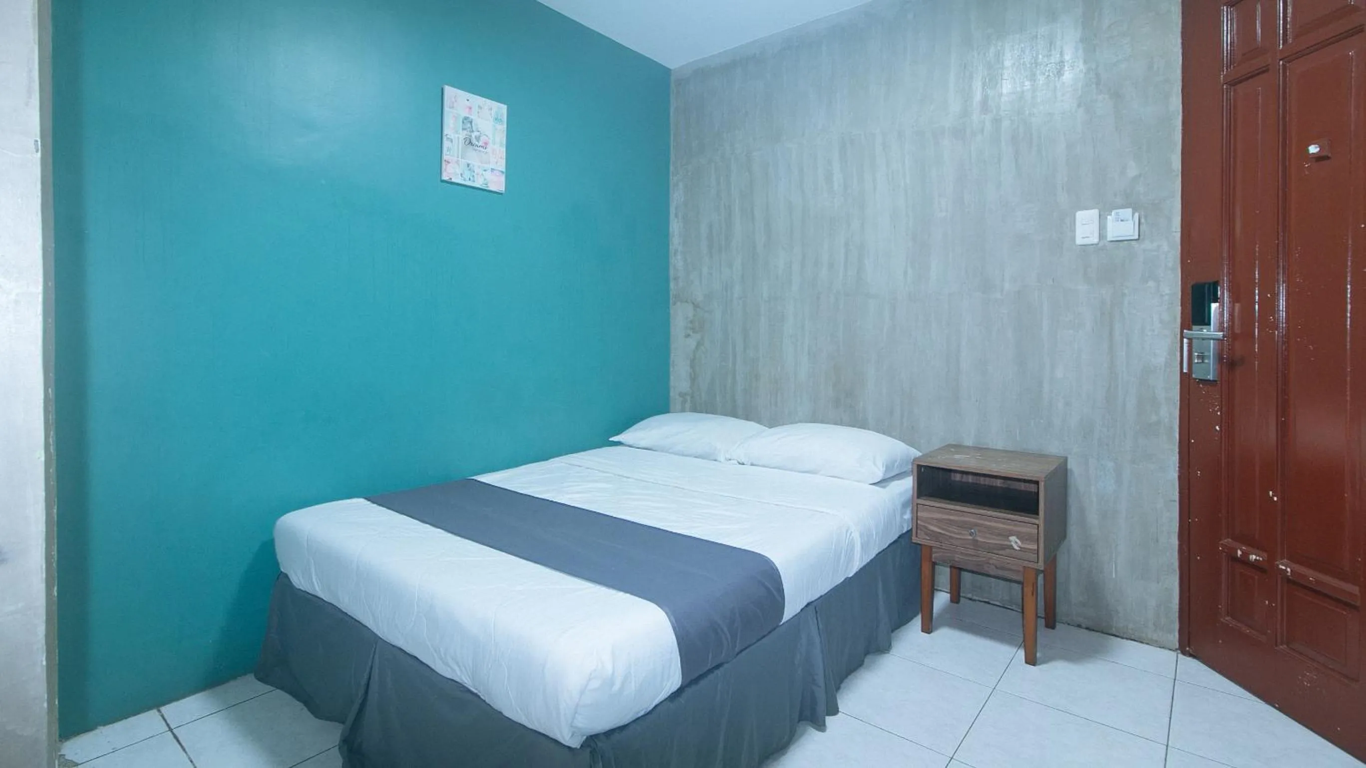 Bed in Rcee Place by RedDoorz