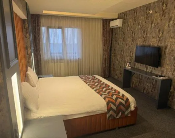 Bed in GRAND DORA HOTEL