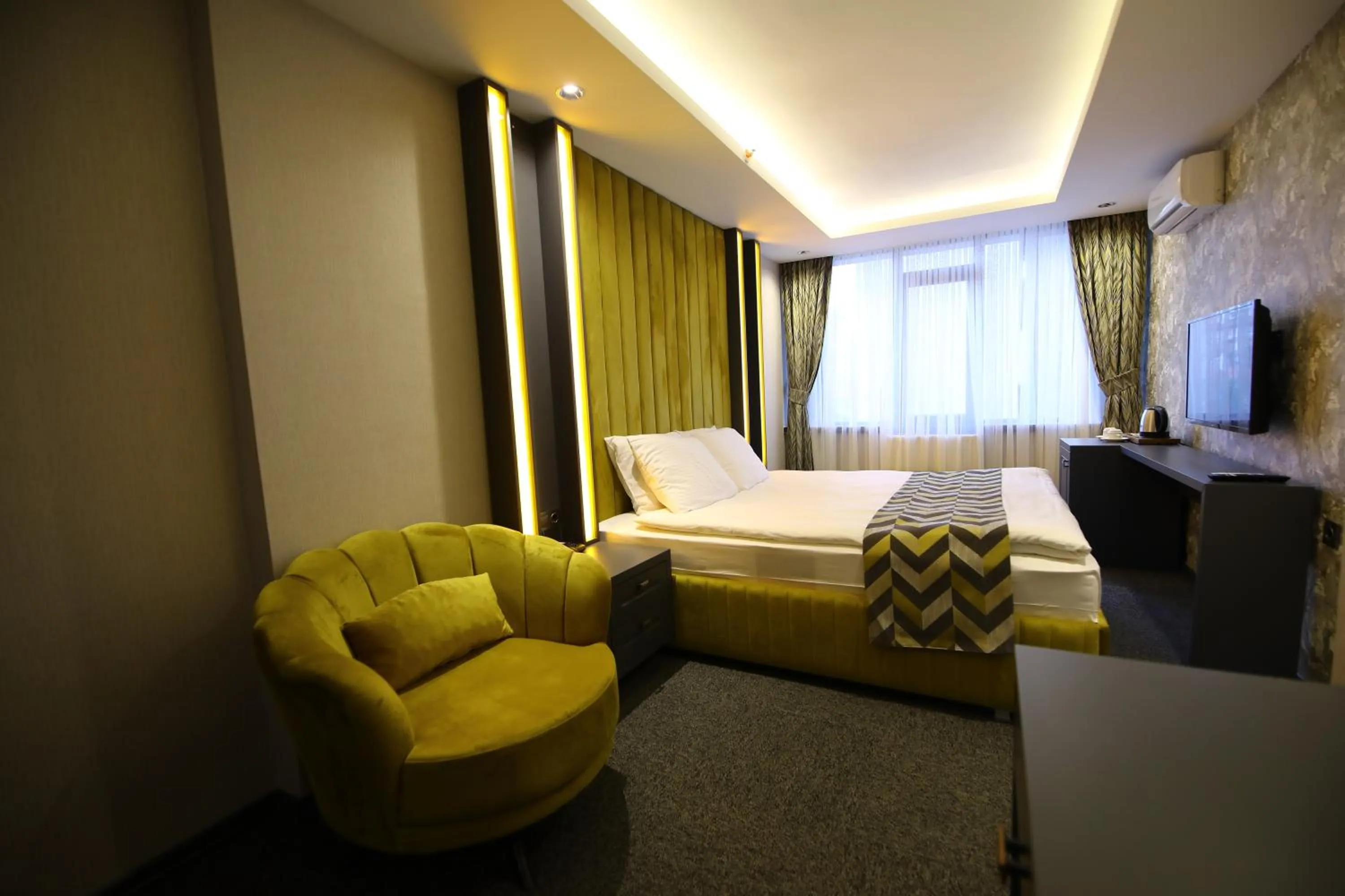 Bed in GRAND DORA HOTEL