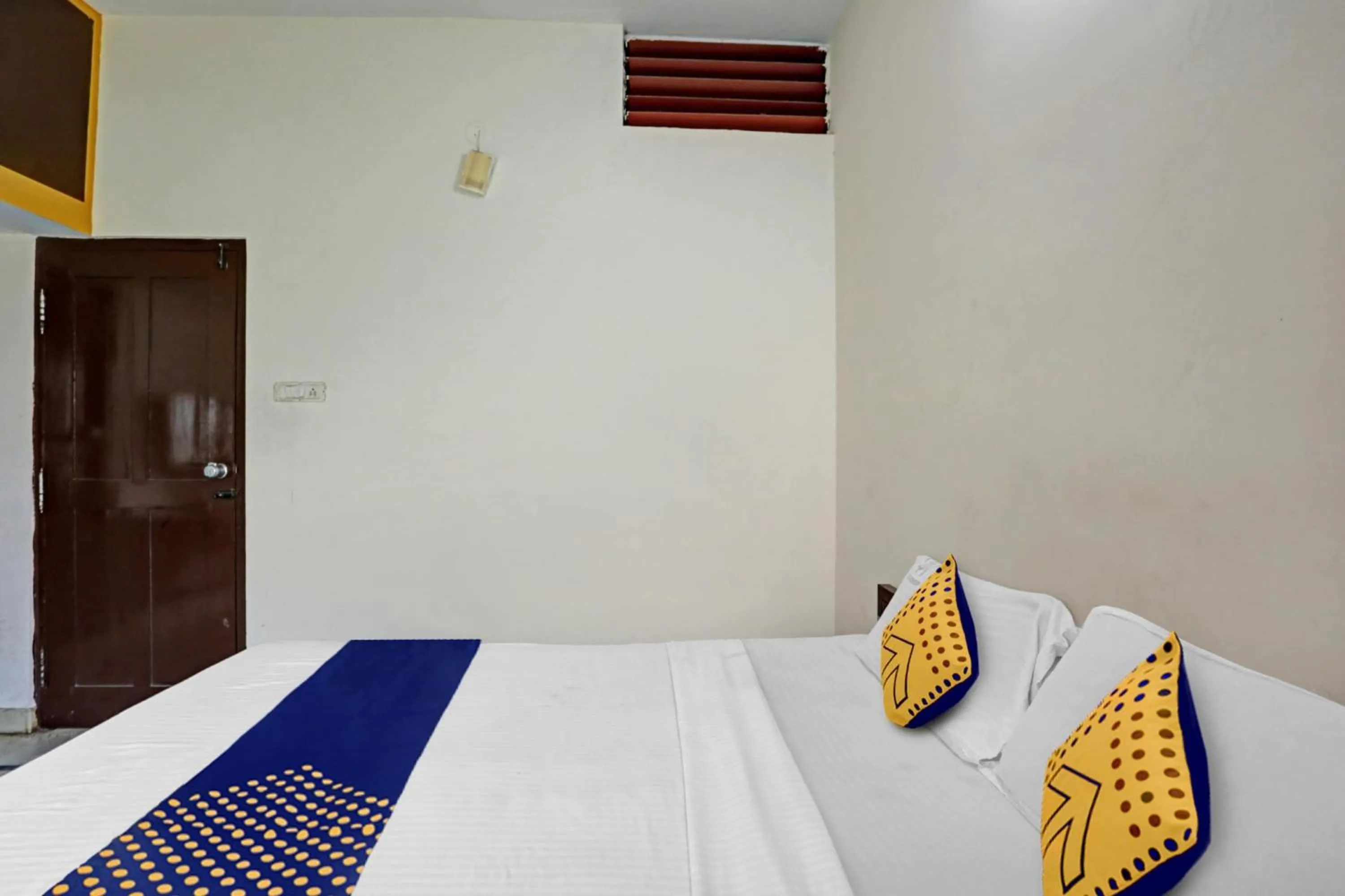 Bedroom in Hotel O Vishu Moni Residency