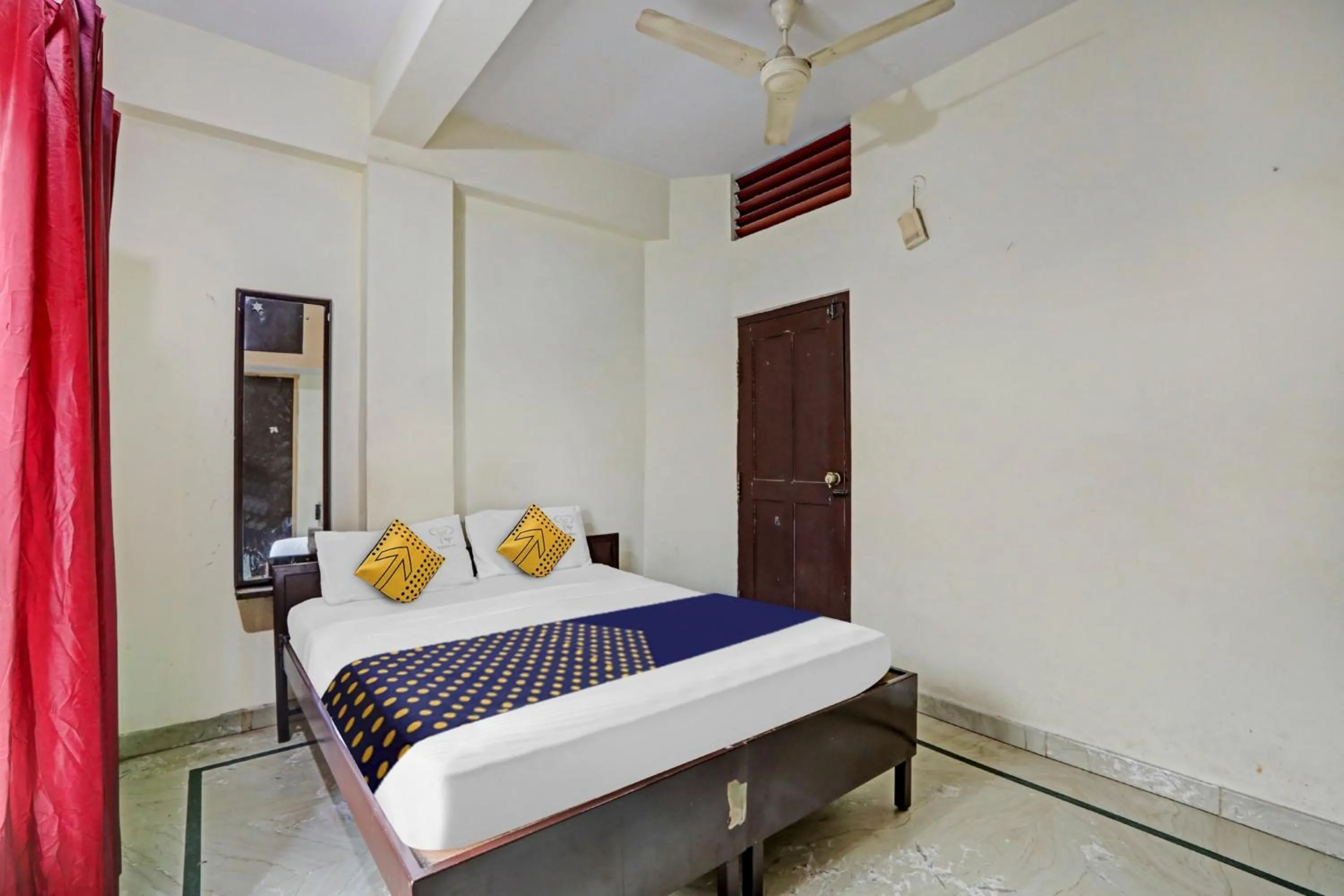 Bedroom in Hotel O Vishu Moni Residency