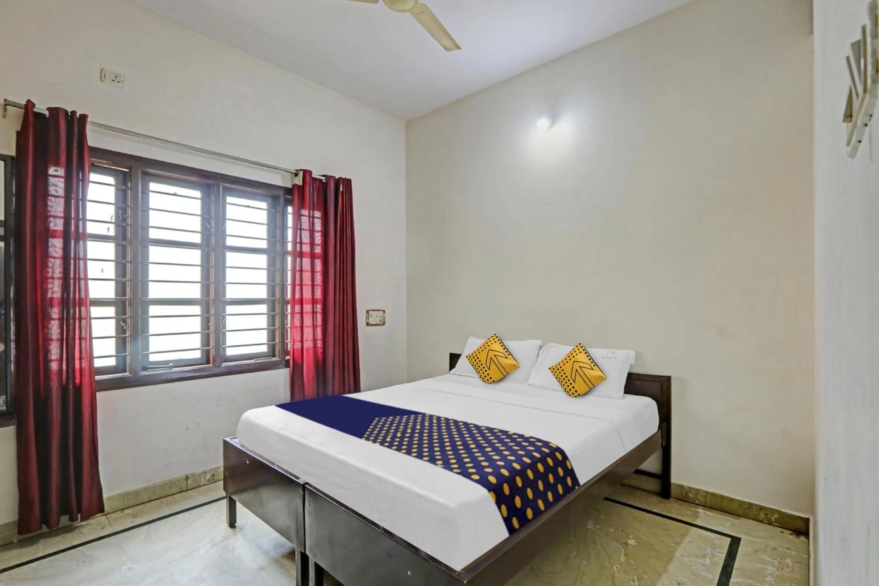 Bedroom in Hotel O Vishu Moni Residency