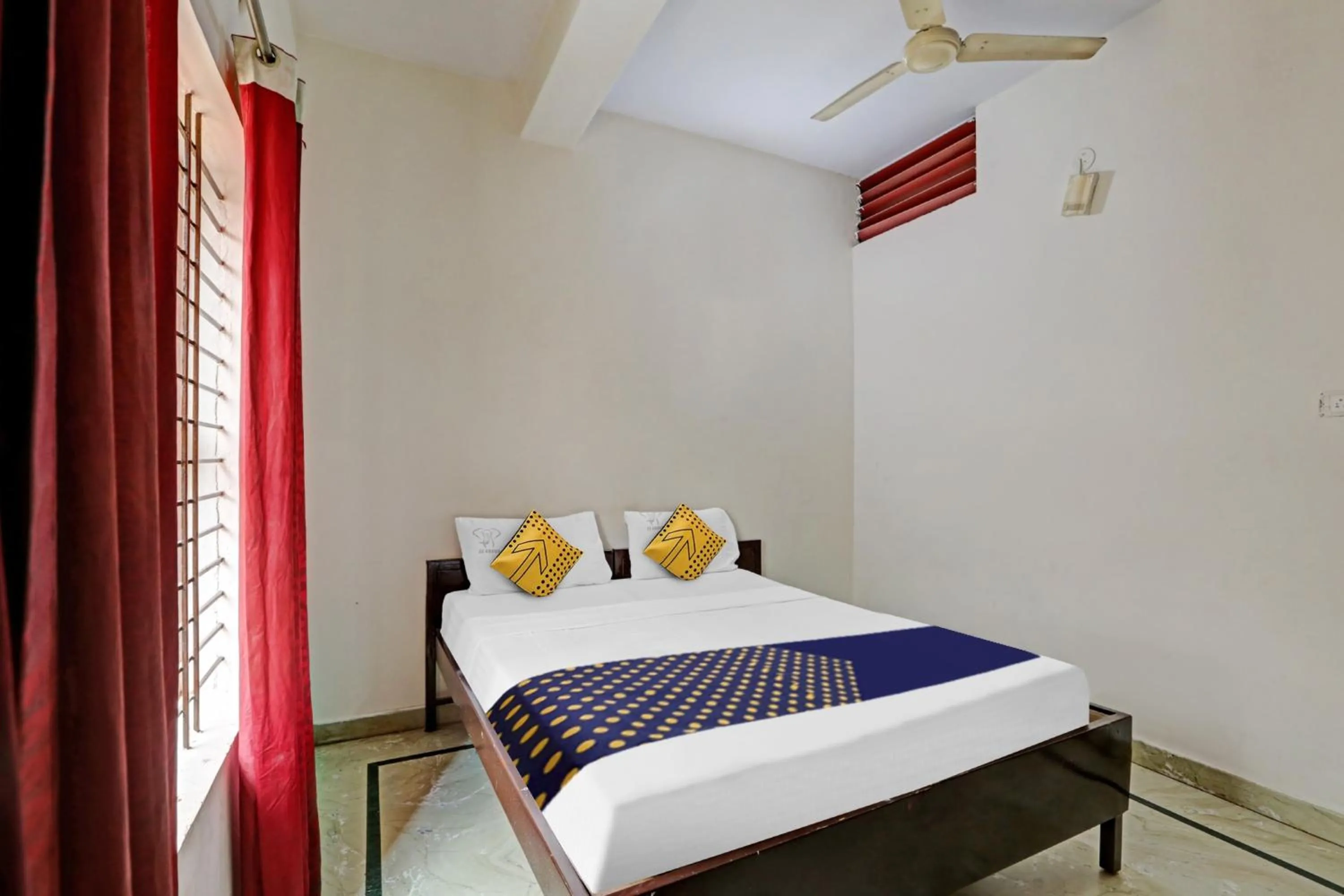 Bedroom in Hotel O Vishu Moni Residency