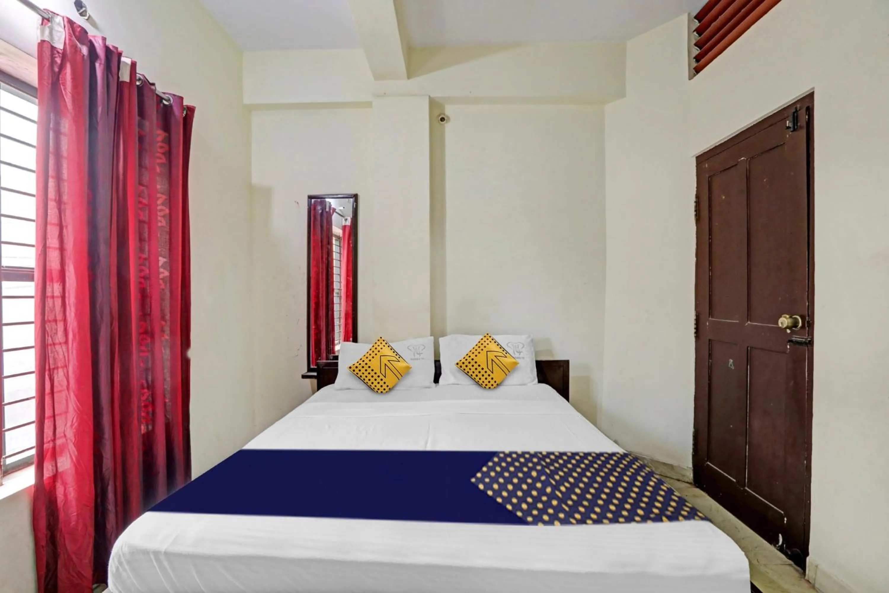 Bedroom in Hotel O Vishu Moni Residency