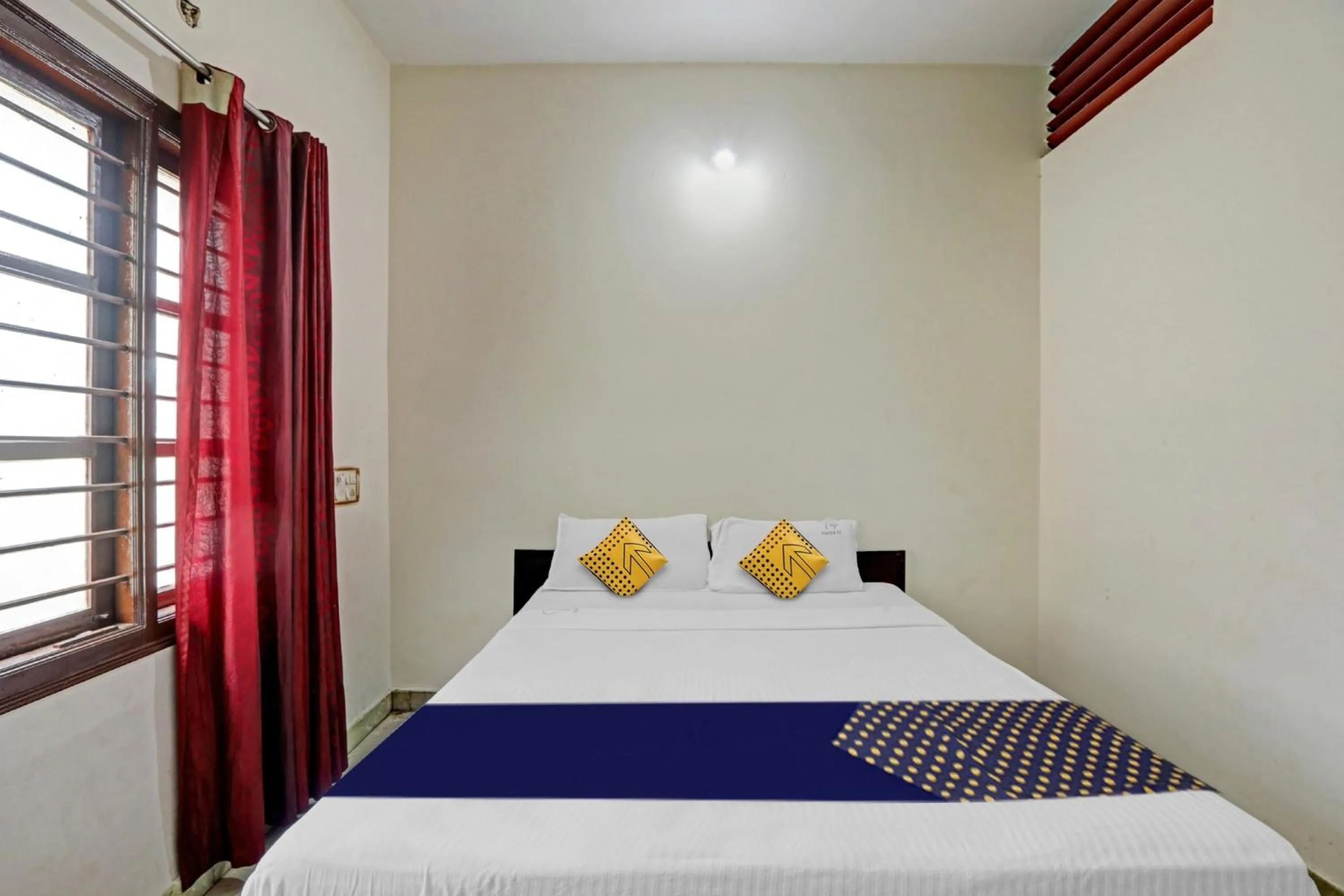 Bedroom in Hotel O Vishu Moni Residency