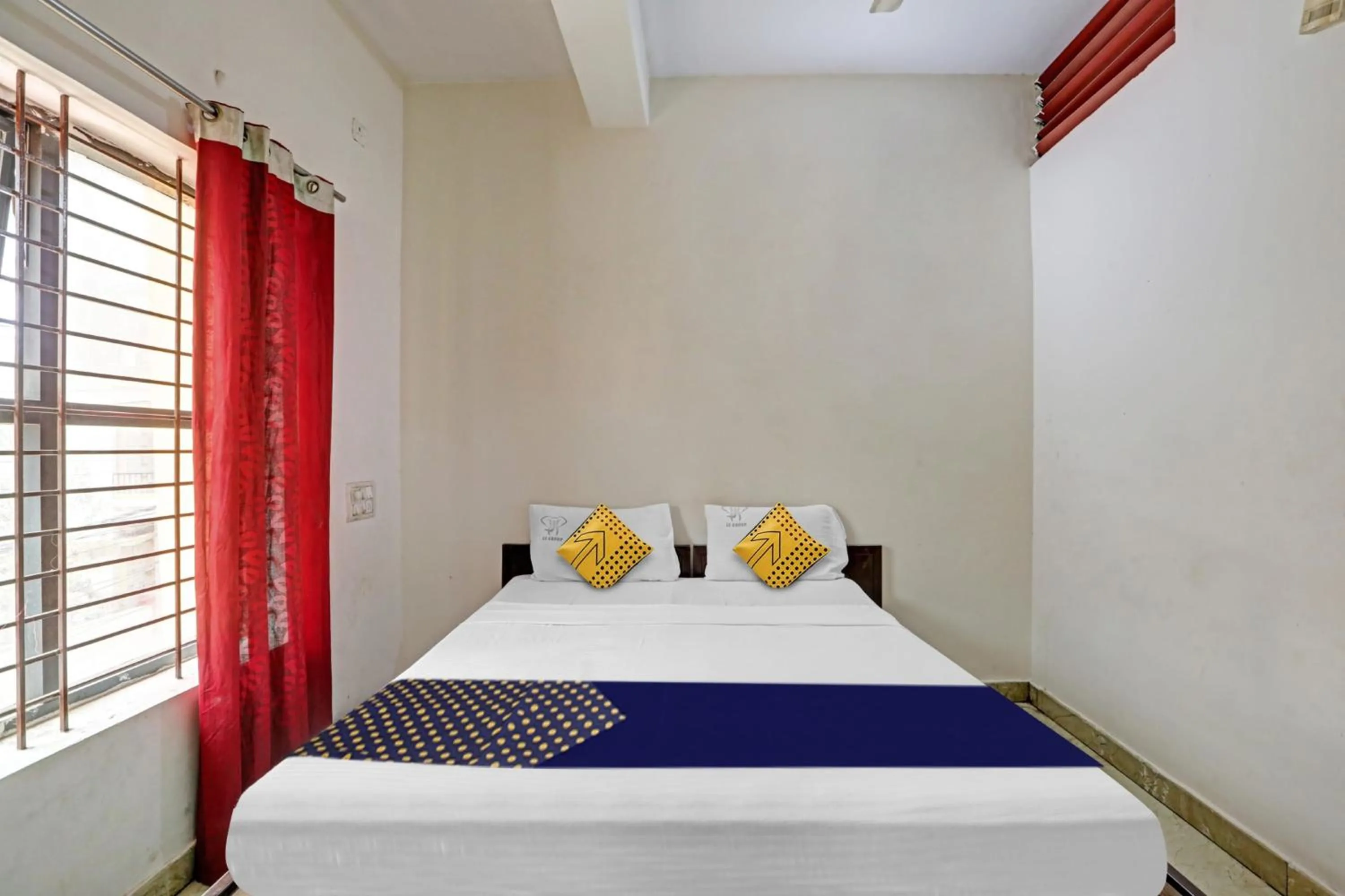 Bedroom in Hotel O Vishu Moni Residency