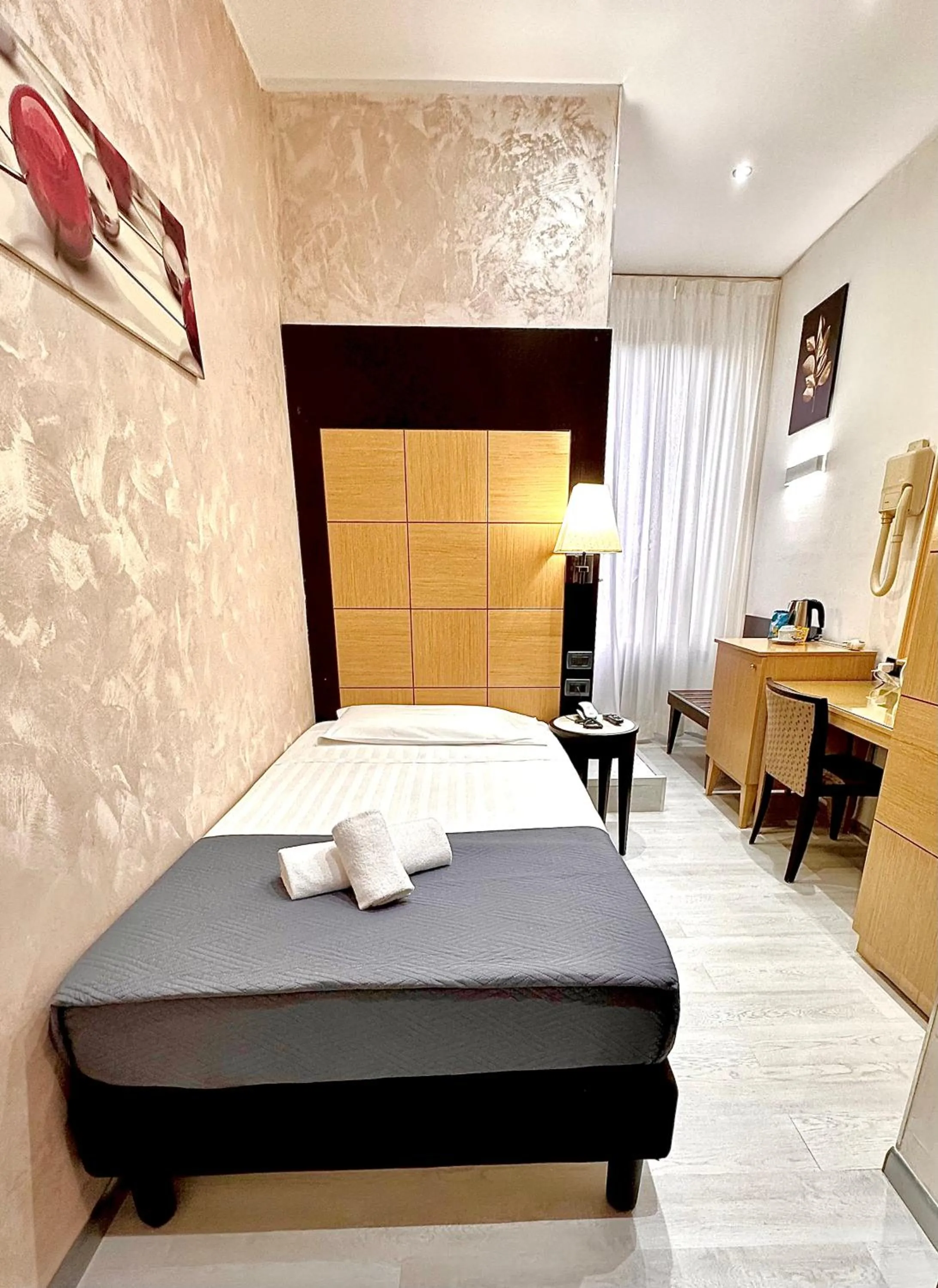 Photo of the whole room, Bed in Hotel Fiorella Milano