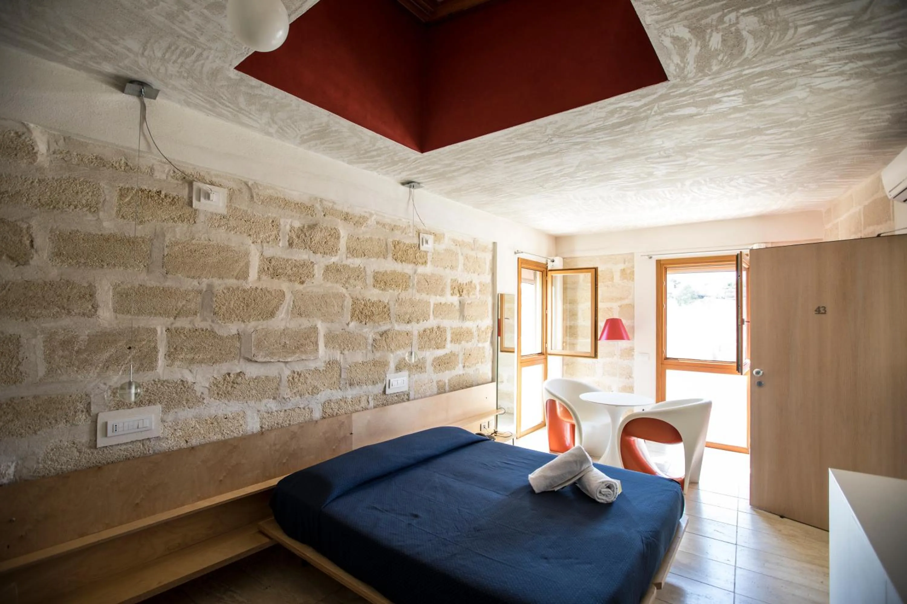 Bed in Cave Bianche Hotel