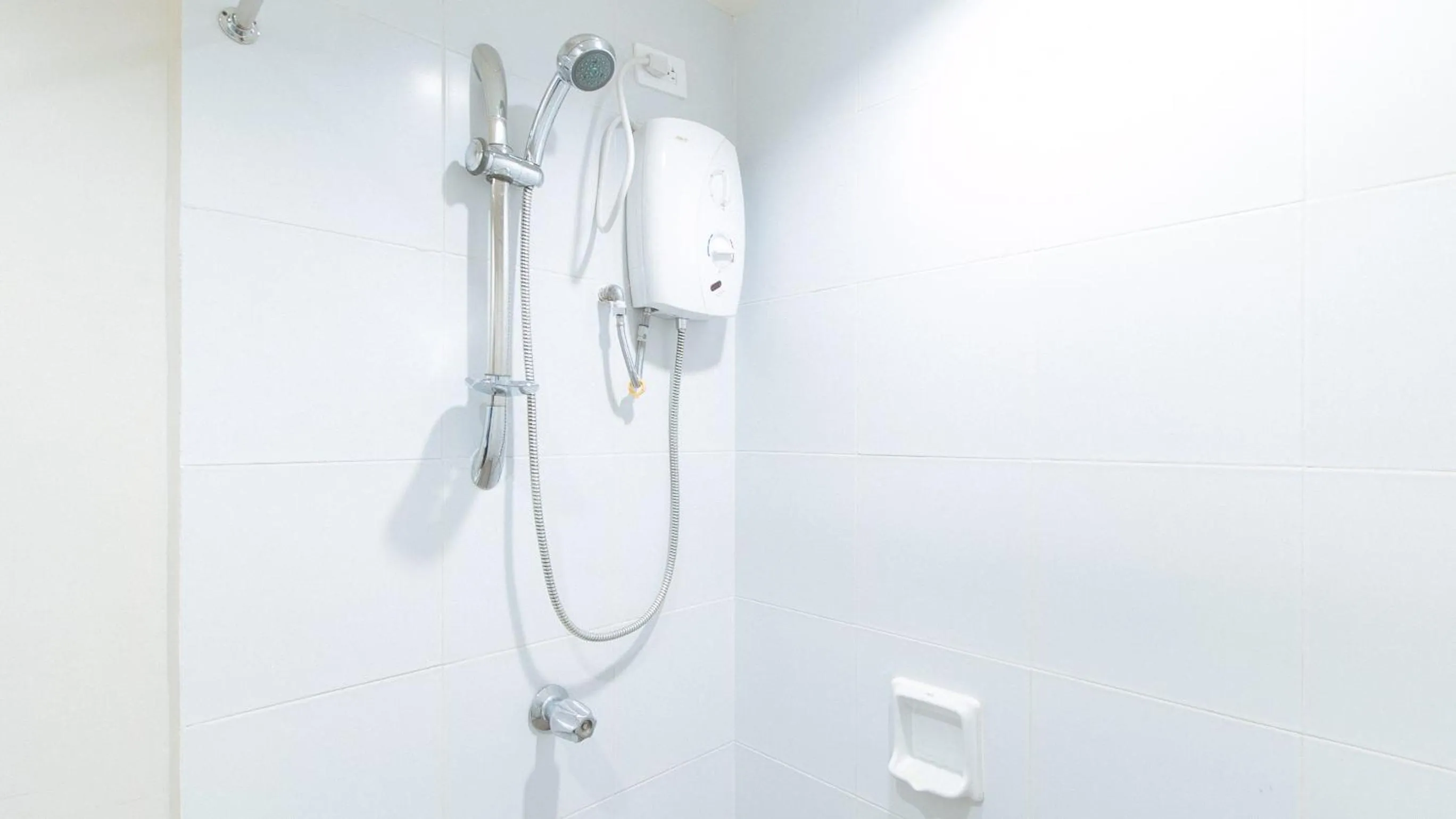 Shower in Filmore Suites Makati by RedDoorz