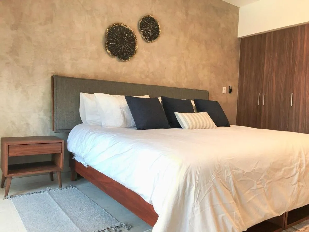 Bed in Deluxe Studio Aparment Mamitas Zone