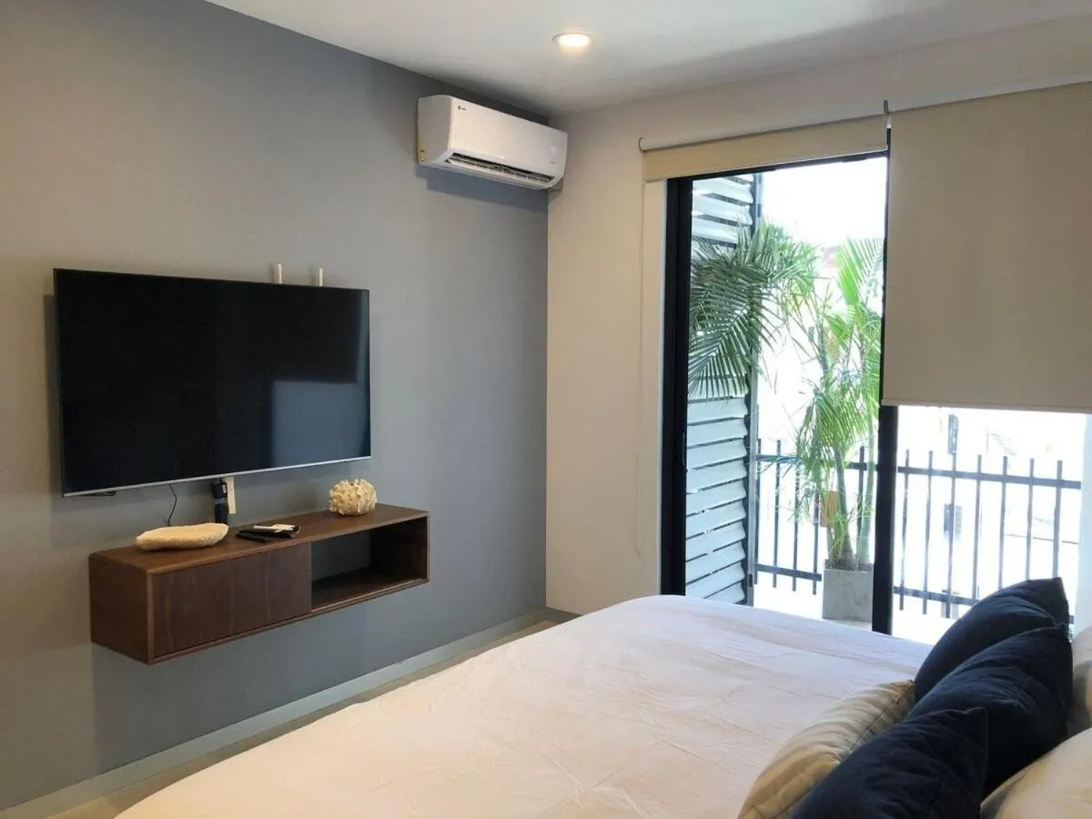 Bed in Deluxe Studio Aparment Mamitas Zone