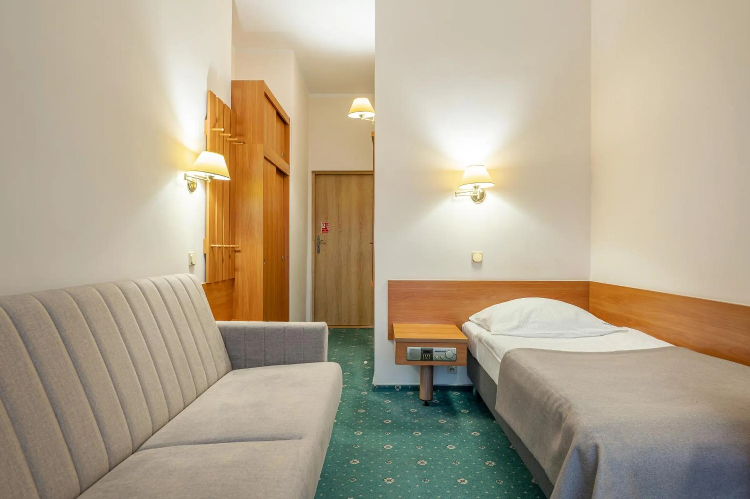 Seating area, Bed in Hotel Wodnik