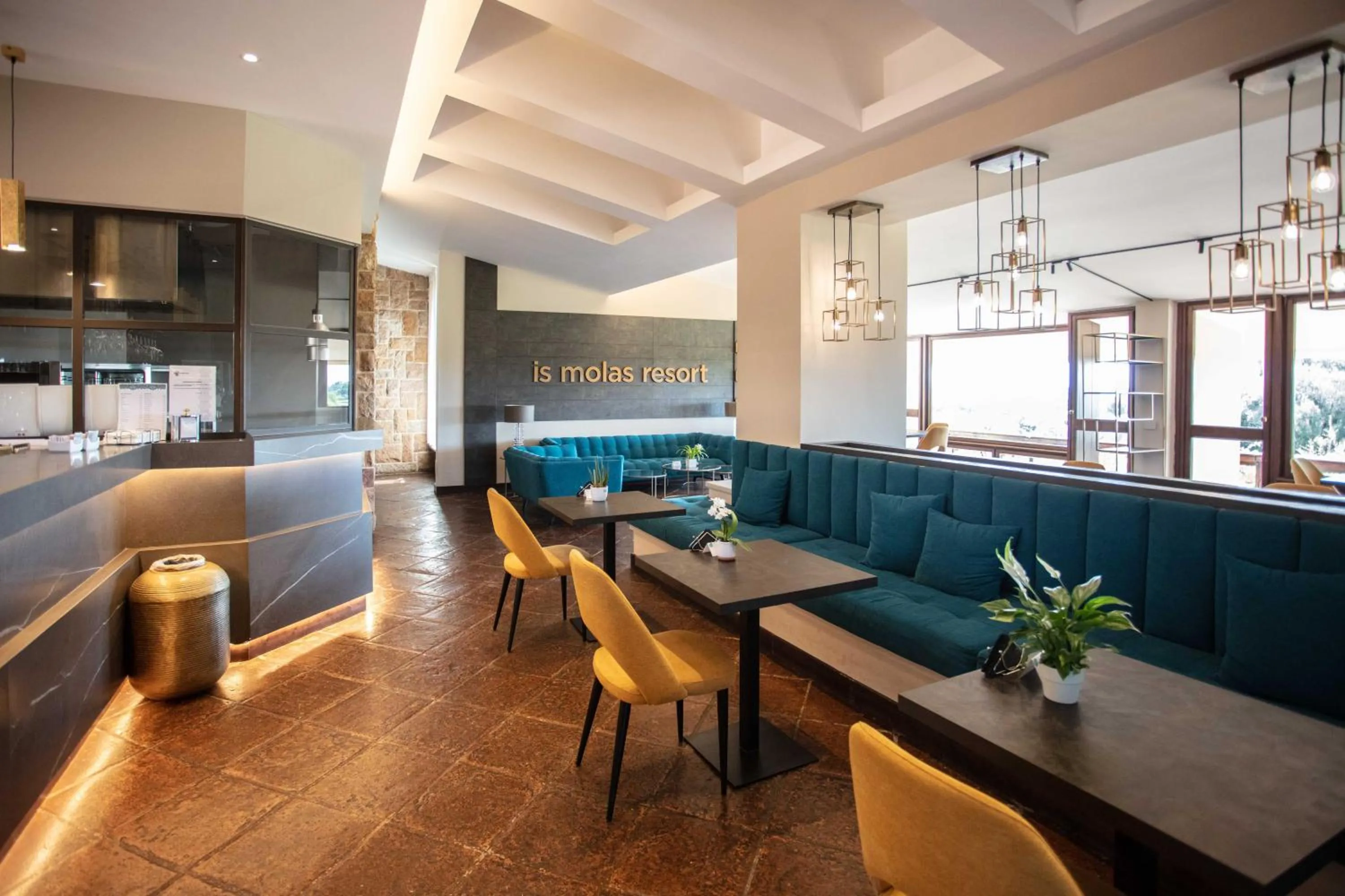 Lounge or bar in Is Molas Resort