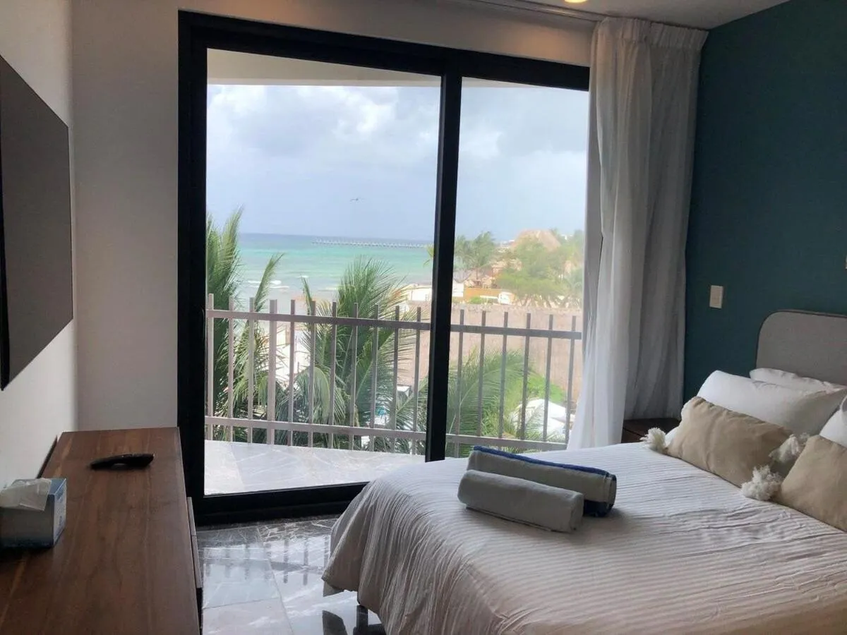 Bed in Deluxe Aparment Whit Beach & Ocean View 8 Pax