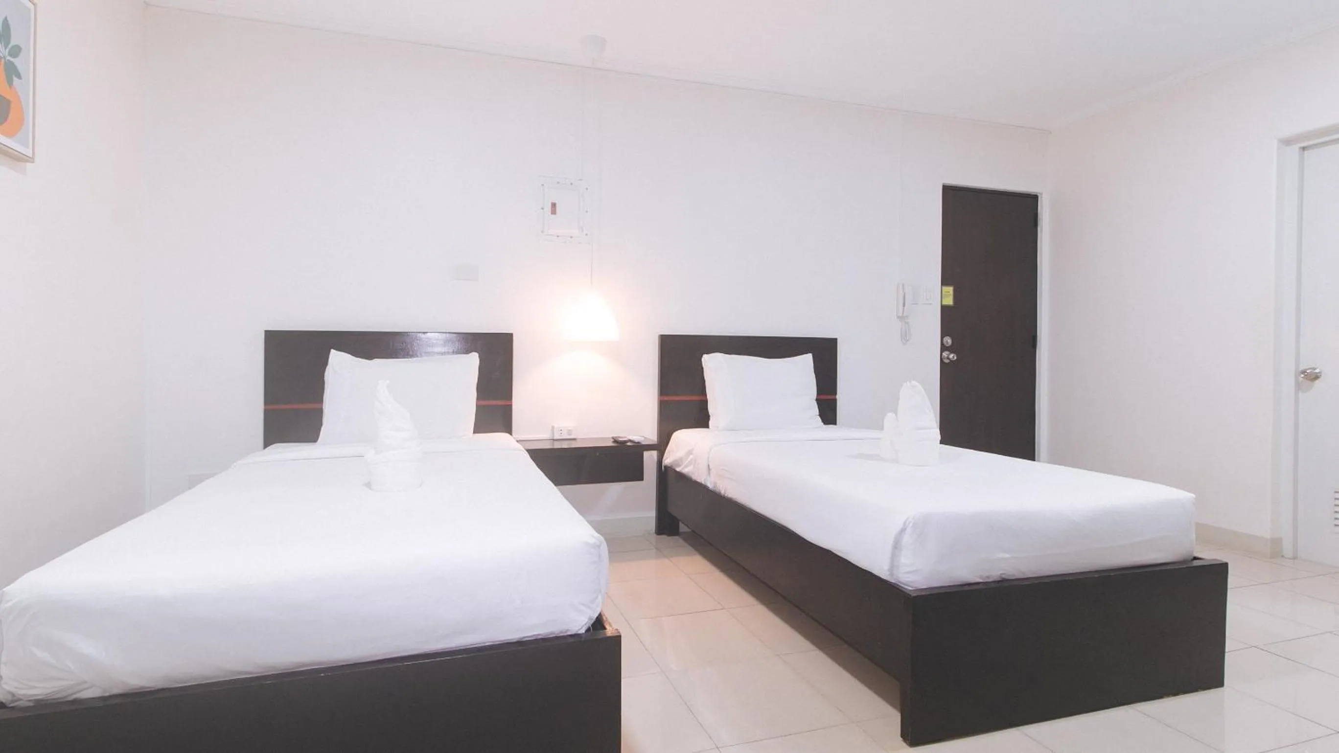 Photo of the whole room, Bed in UrbanView at Evangelista Street Makati