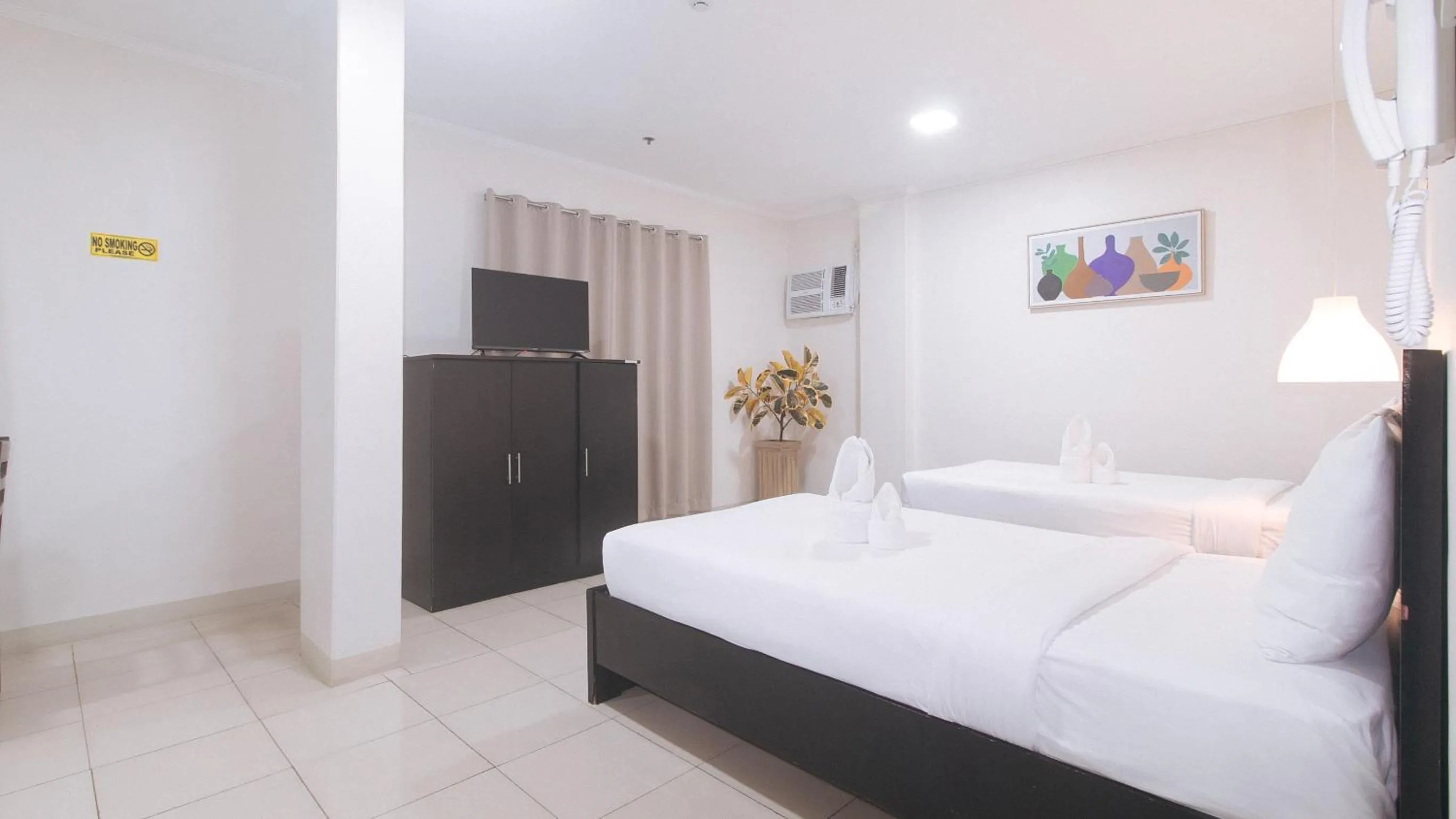 Photo of the whole room, Bed in UrbanView at Evangelista Street Makati