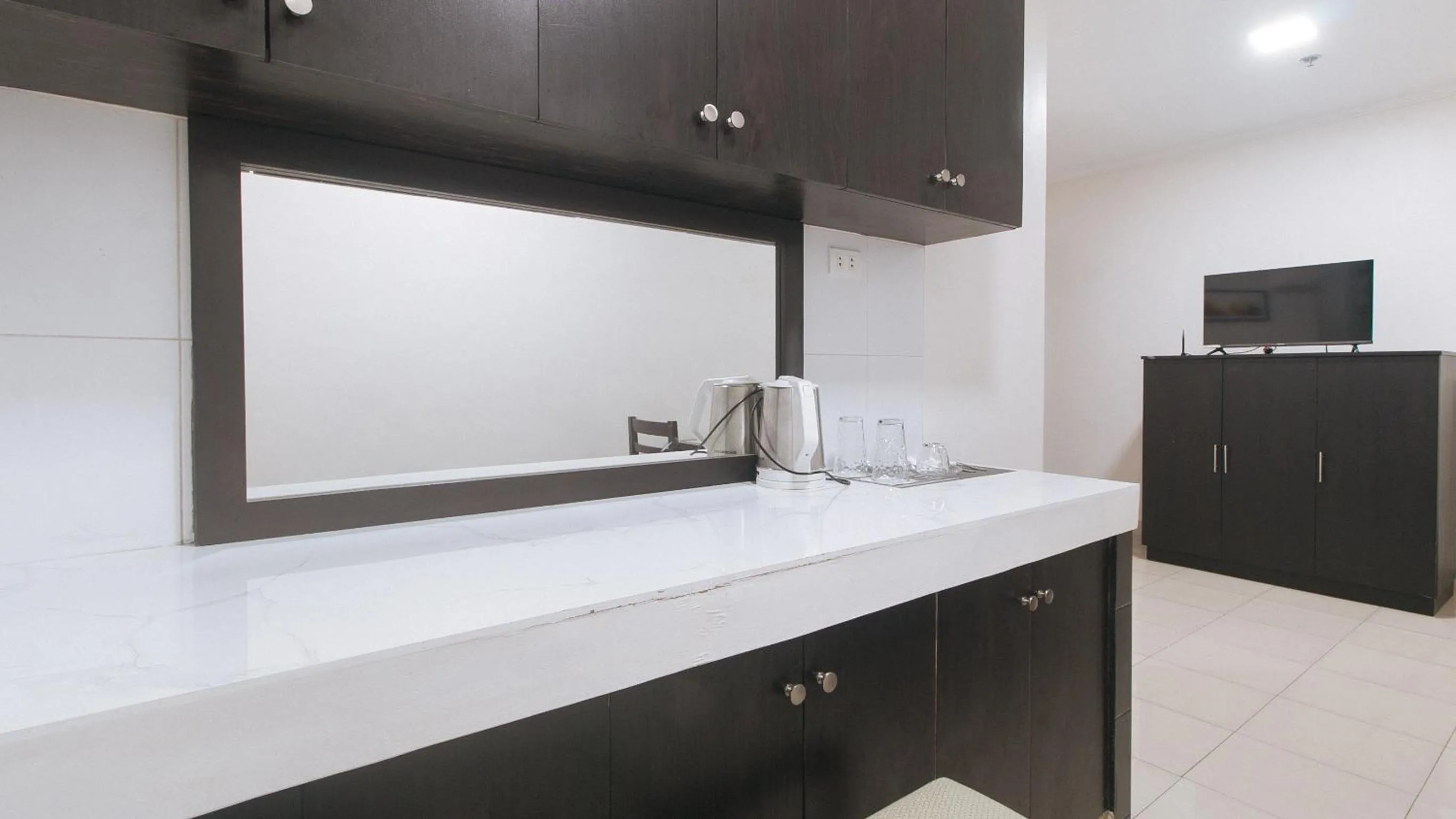 Kitchen or kitchenette in UrbanView at Evangelista Street Makati