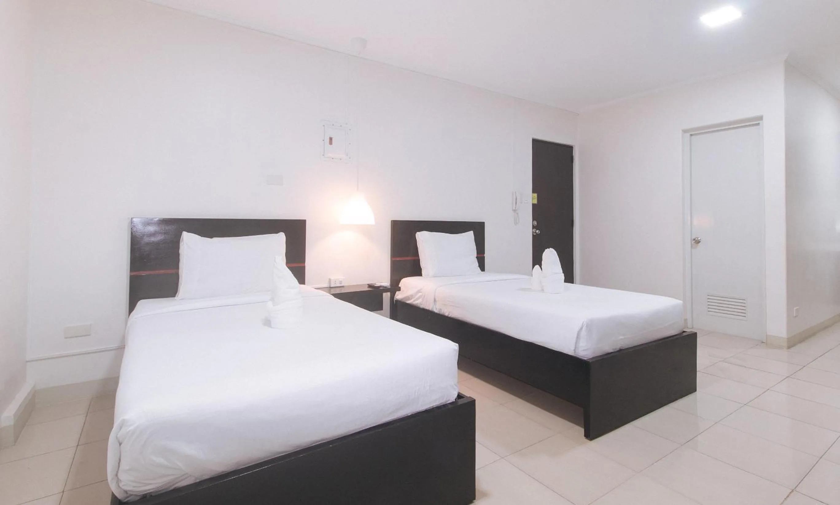 Photo of the whole room, Bed in UrbanView at Evangelista Street Makati