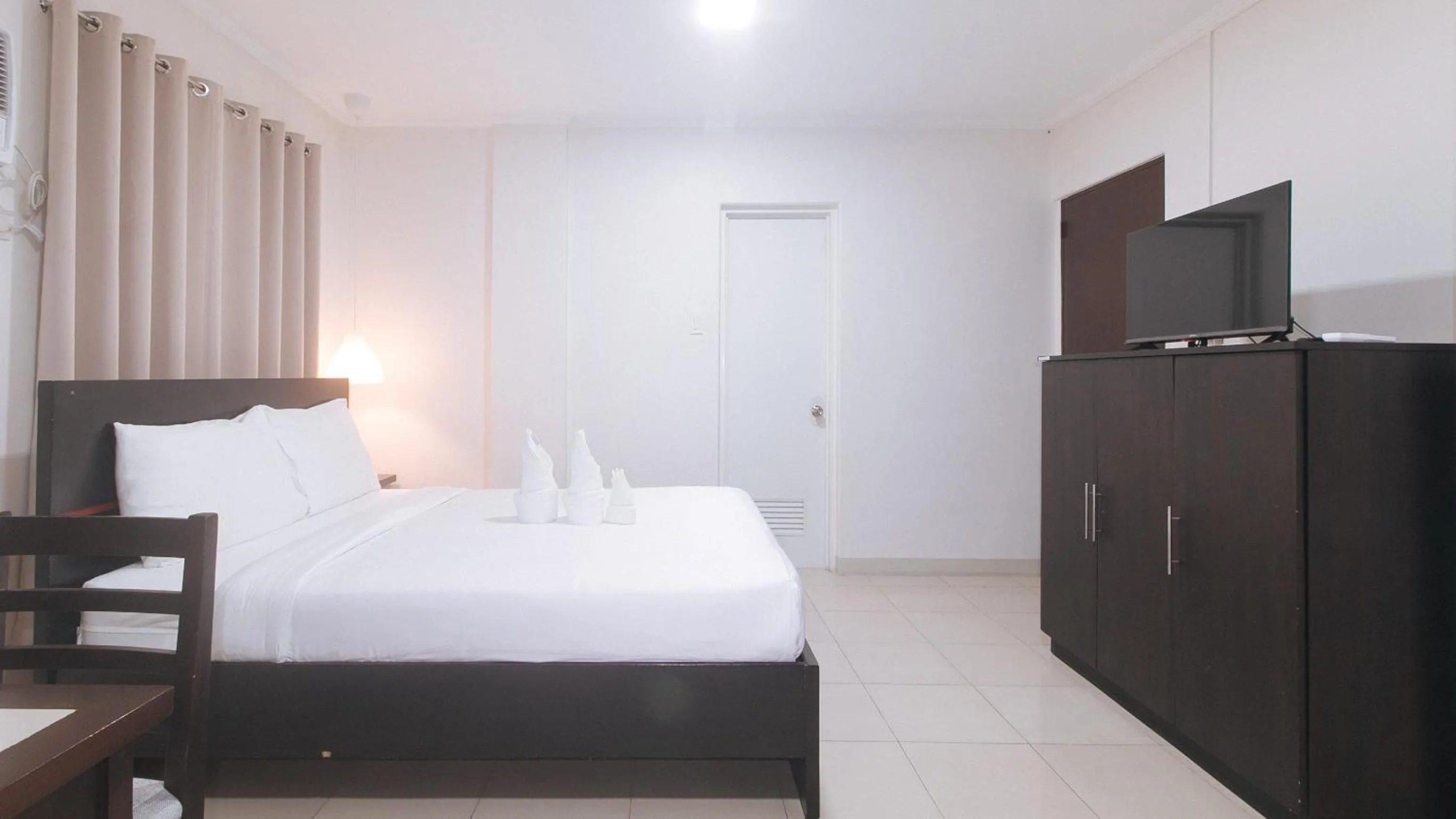 Bedroom, Bed in UrbanView at Evangelista Street Makati