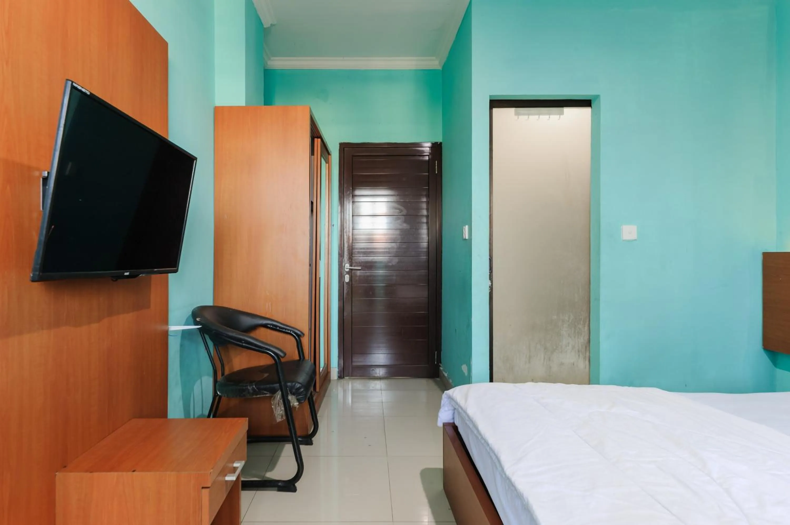 Bedroom, Bed in Gita Inn Bali RedPartner