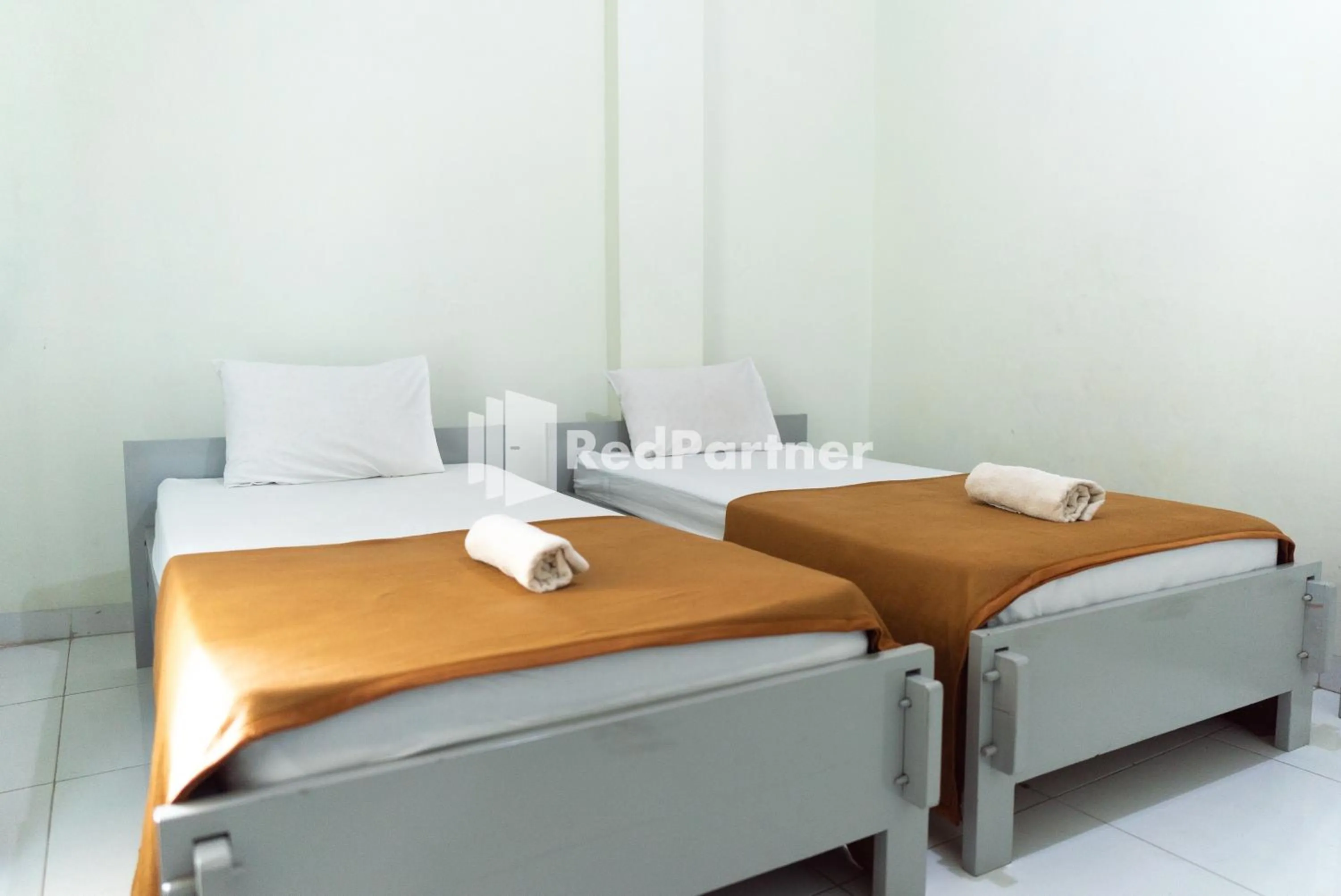Bedroom, Bed in Wisma Aini Syariah Lampung Mitra RedDoorz