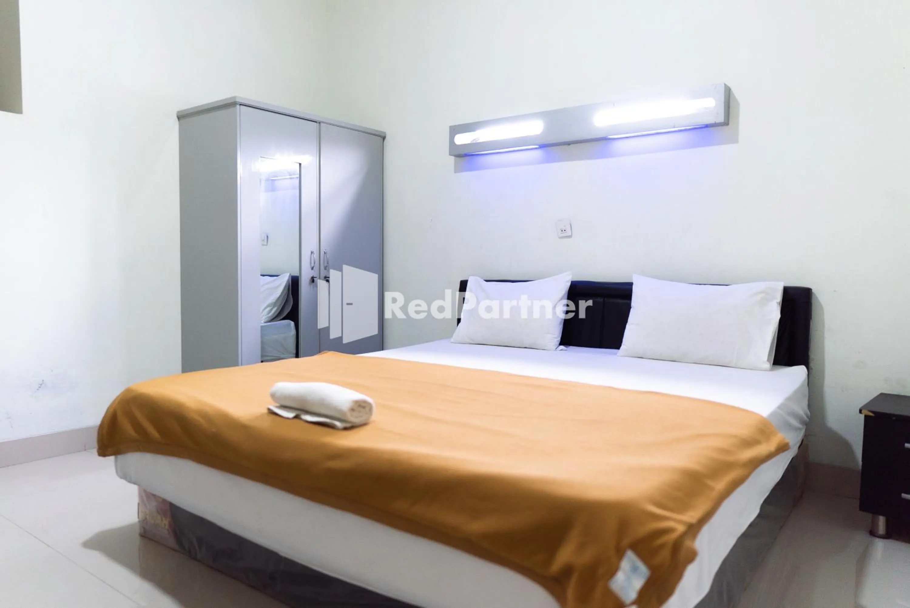 Bedroom, Bed in Wisma Aini Syariah Lampung Mitra RedDoorz