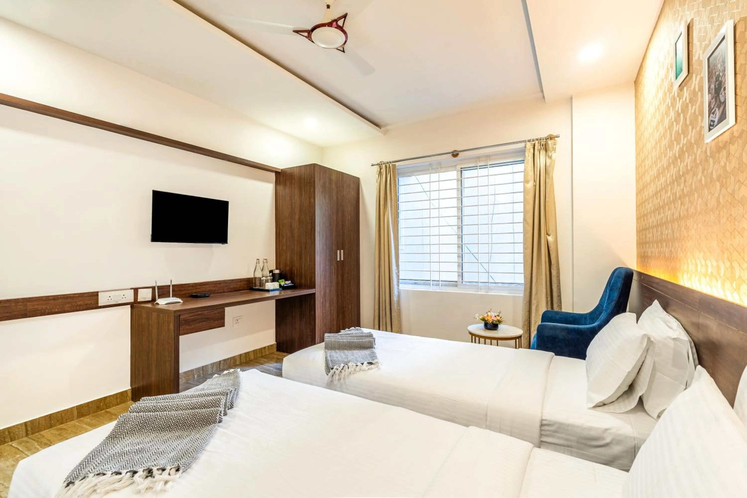 Photo of the whole room, Bed in Bangalore Times by Alaya Stays