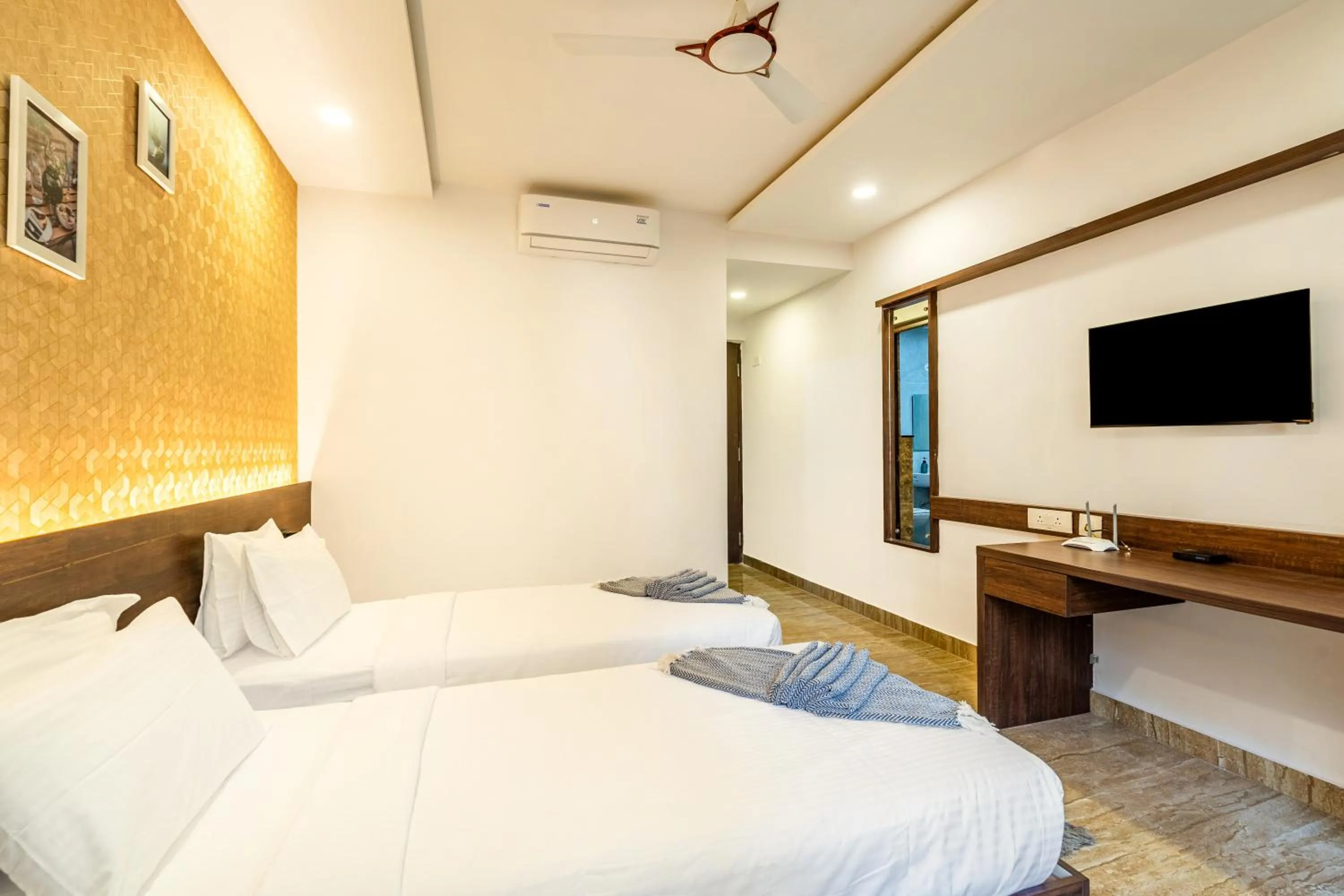 Photo of the whole room, Bed in Bangalore Times by Alaya Stays