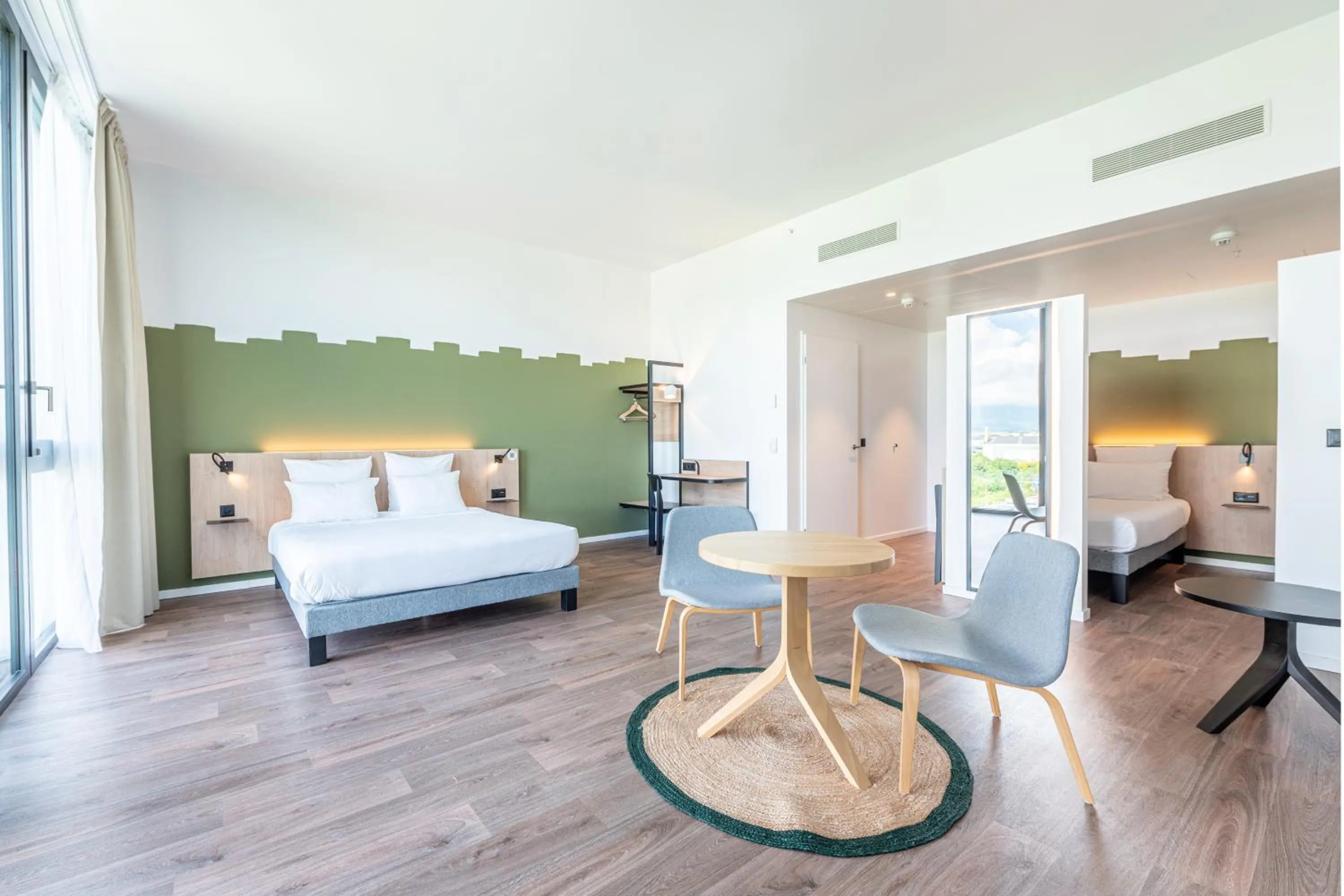 Living room, Bed in B&B HOTEL Geneva Airport