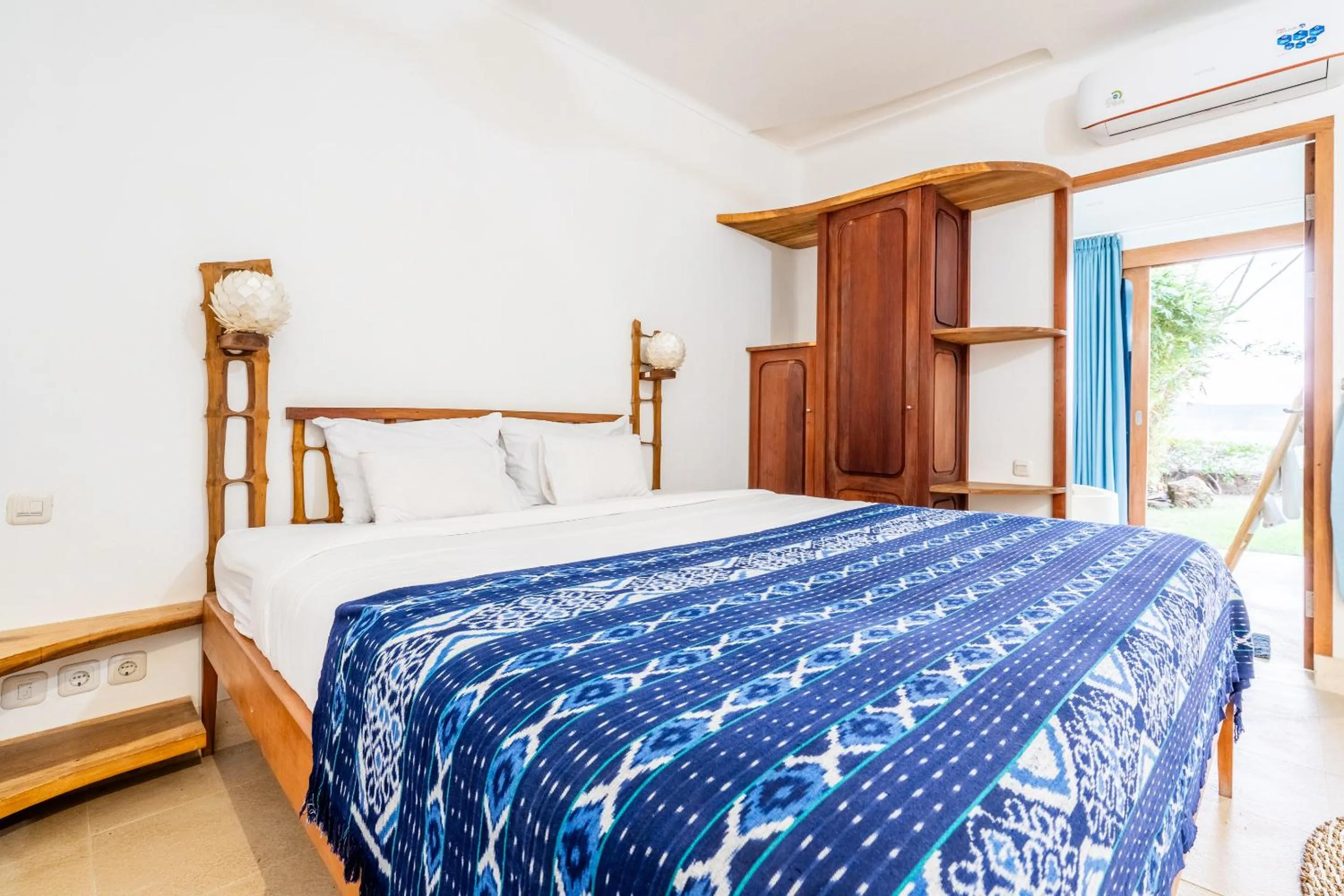 Bed in Inlight Lombok Beach Hotel