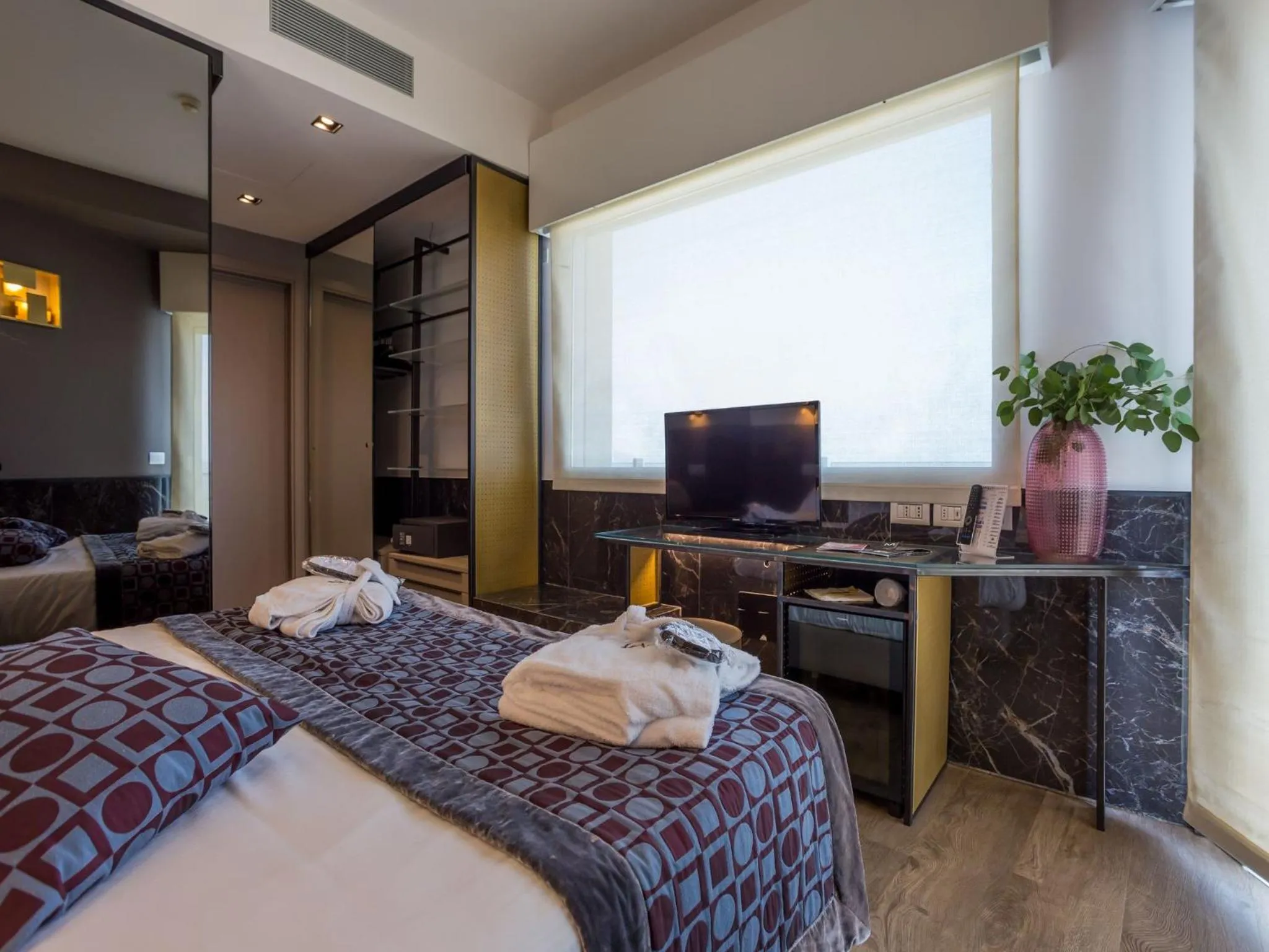 Bed in Hotel Michelangelo