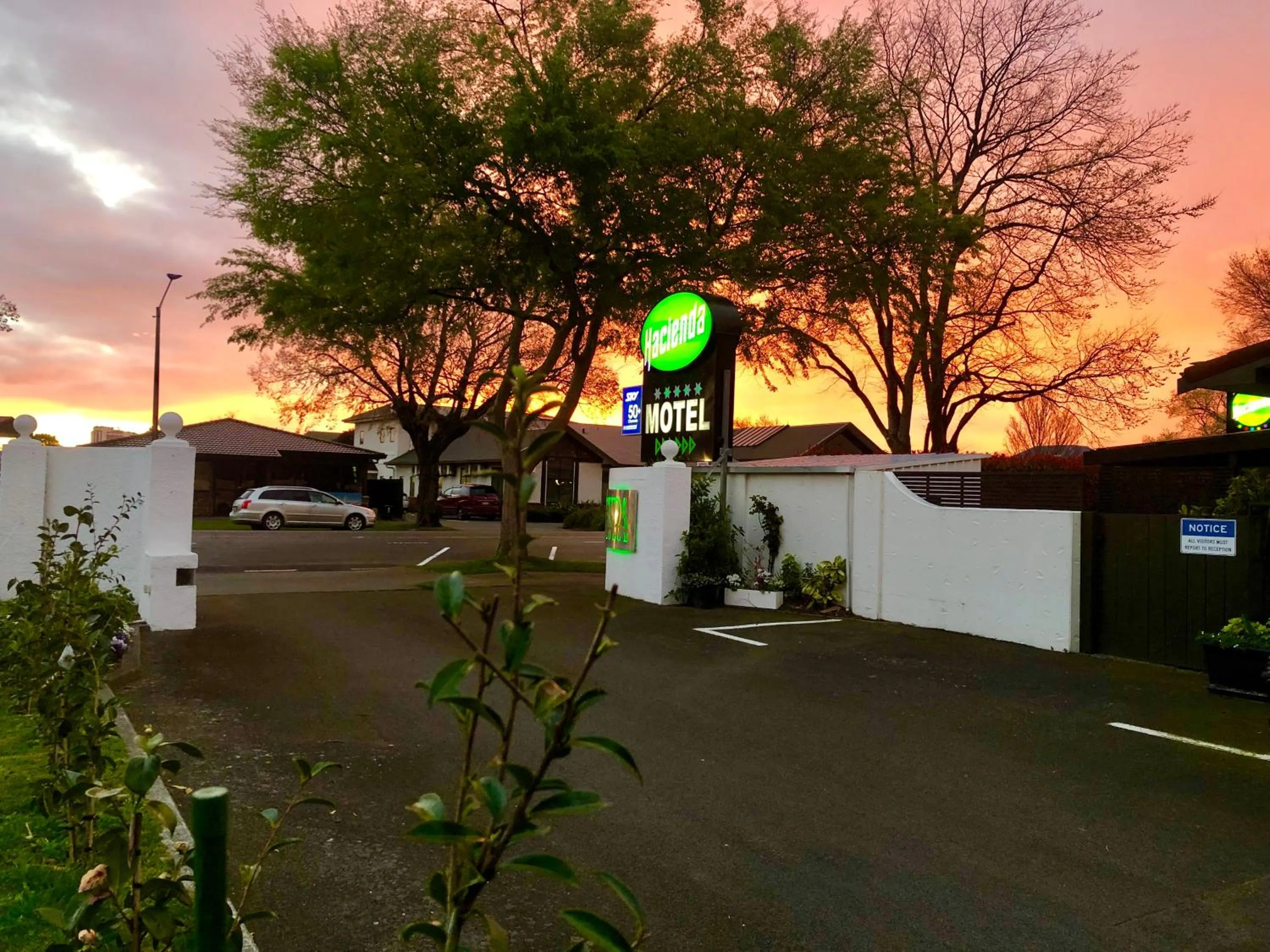 Property logo or sign in Hacienda Motor Lodge