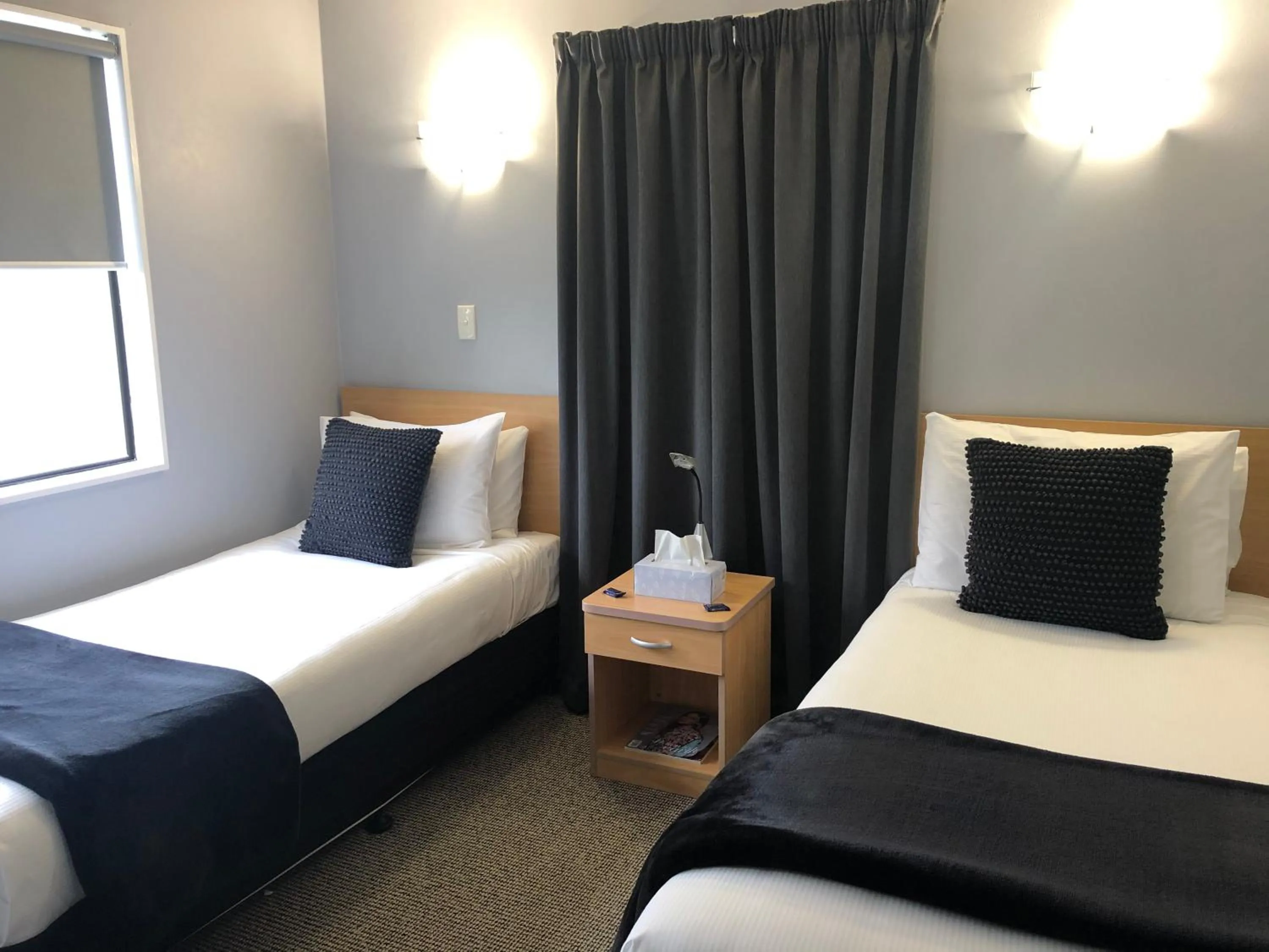 Bed in Hacienda Motor Lodge