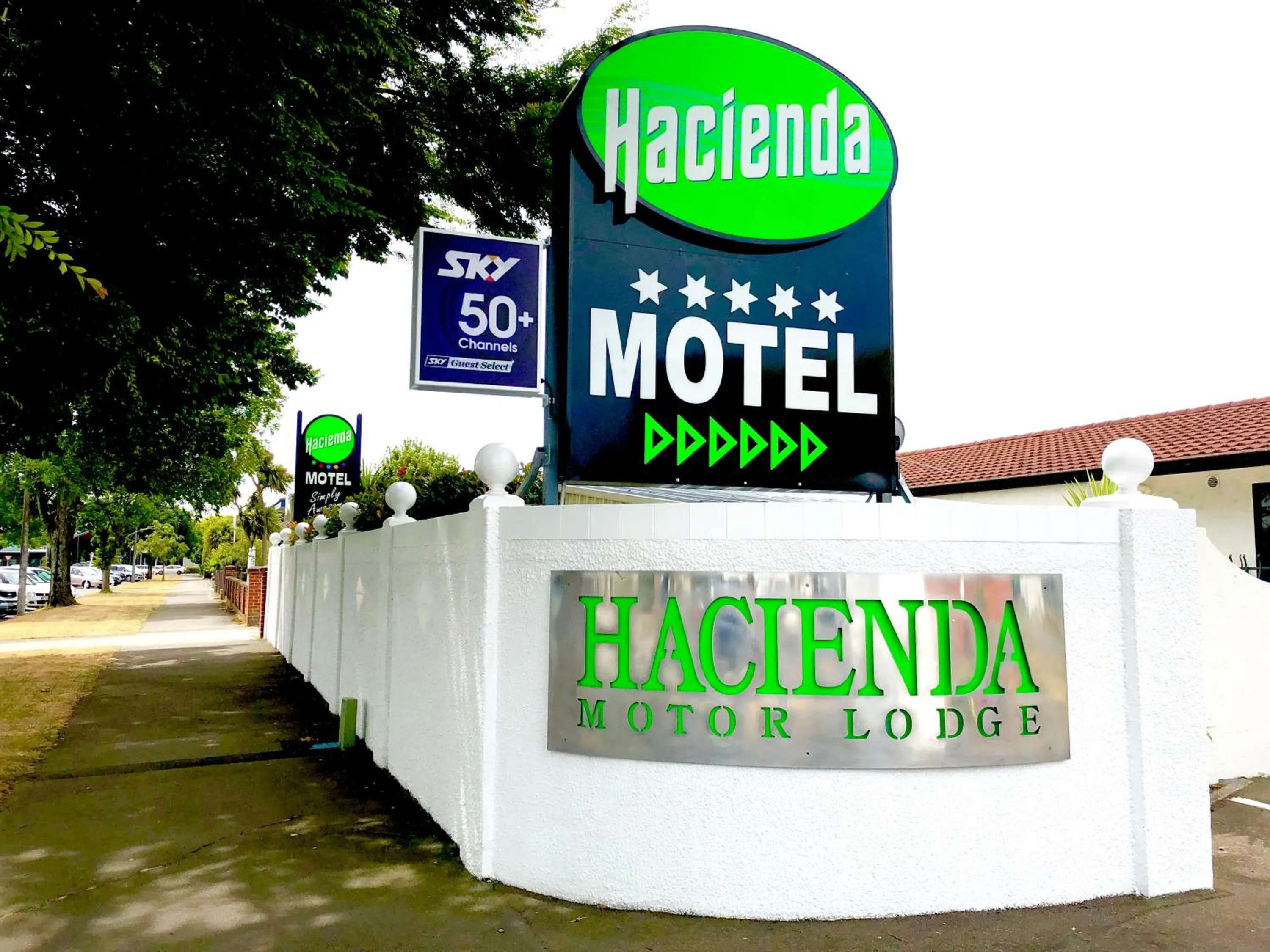 Property logo or sign in Hacienda Motor Lodge