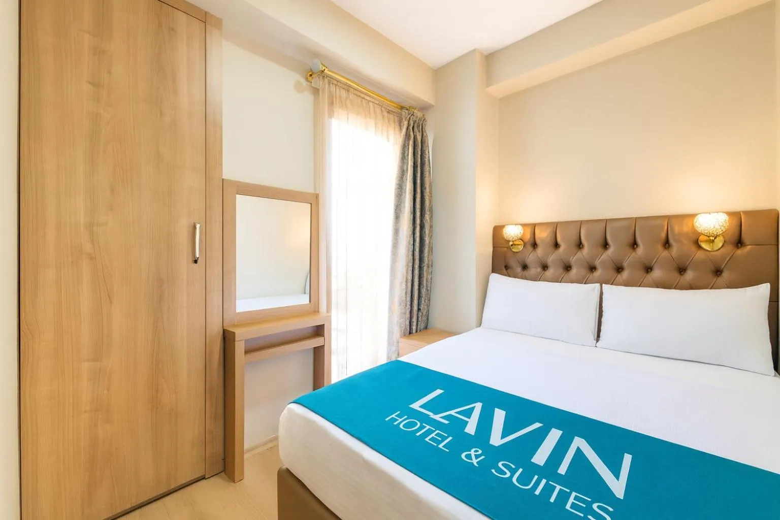 Bed in Lavin Hotel & Suites