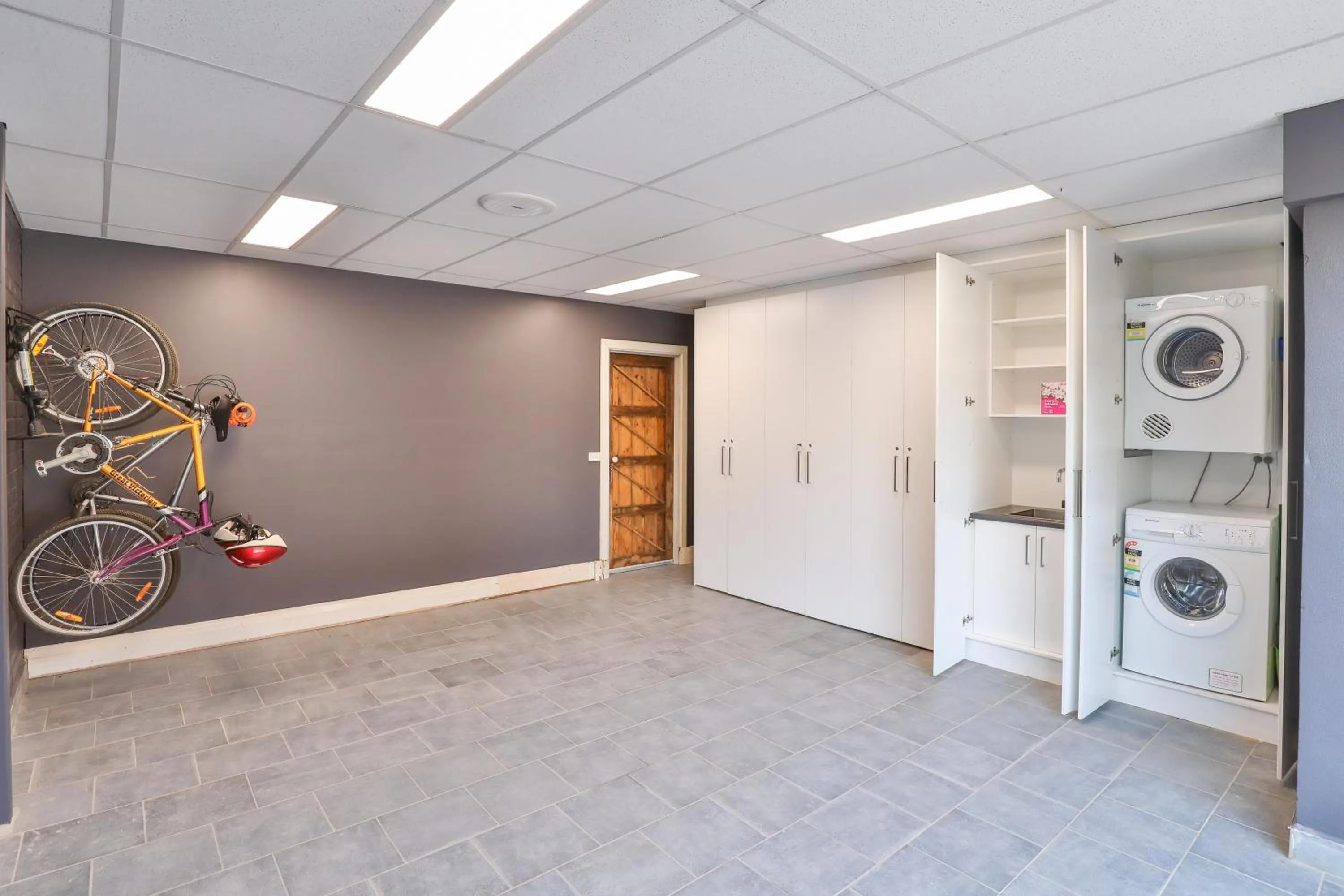 washing machine in Indulge Apartments - Eighth