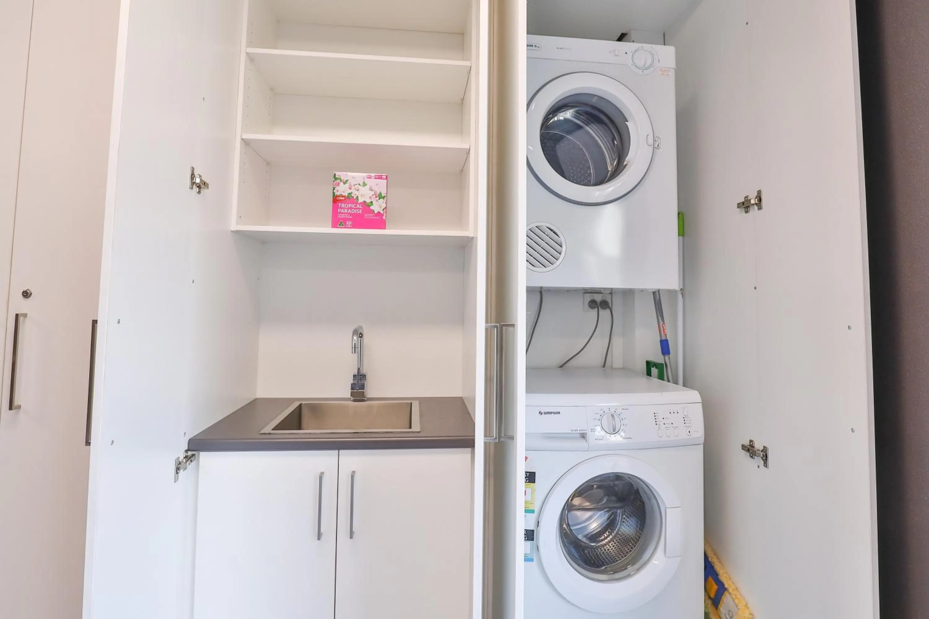 washing machine in Indulge Apartments - Eighth