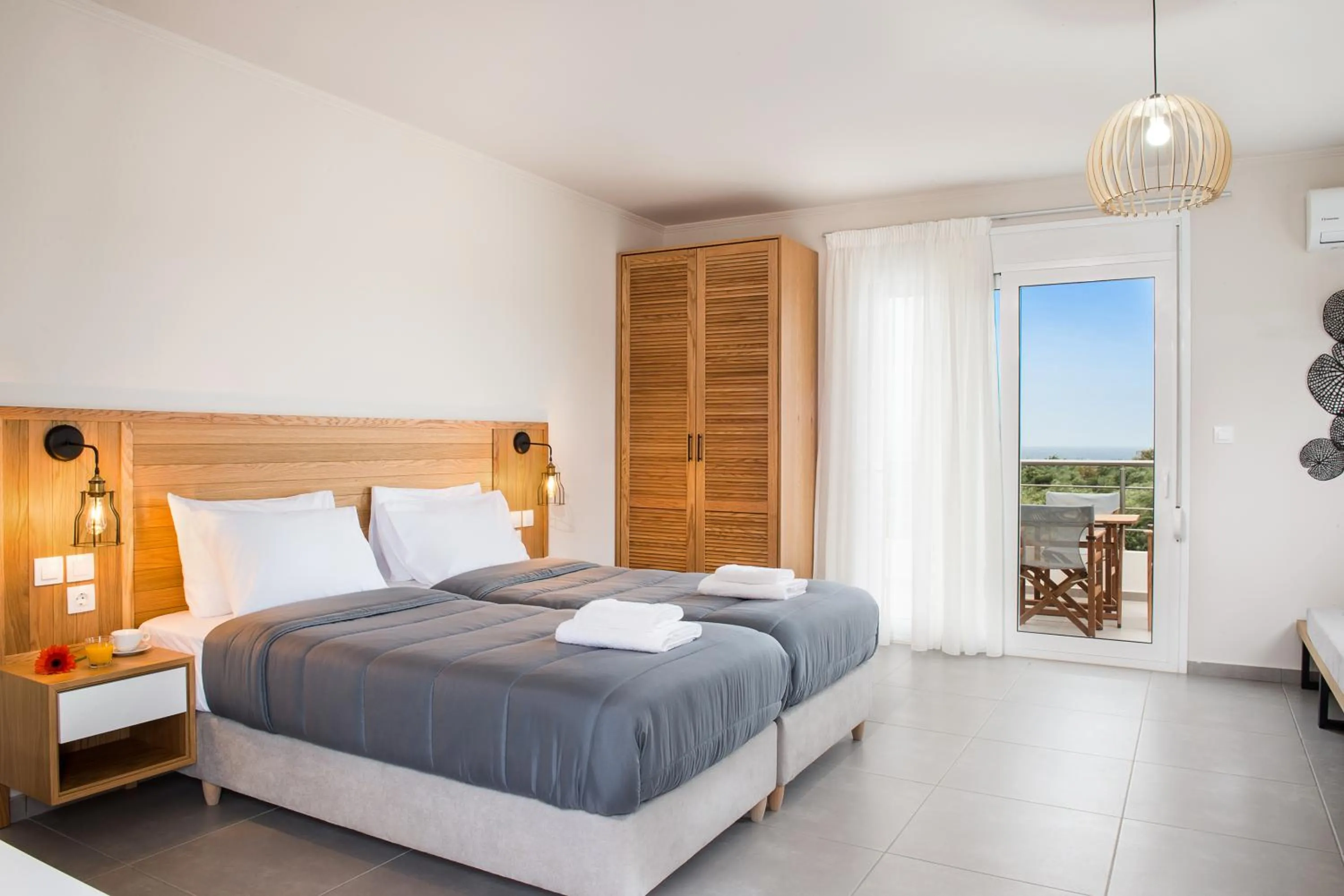 Photo of the whole room, Bed in Elafonisi Resort by Kalomirakis Family