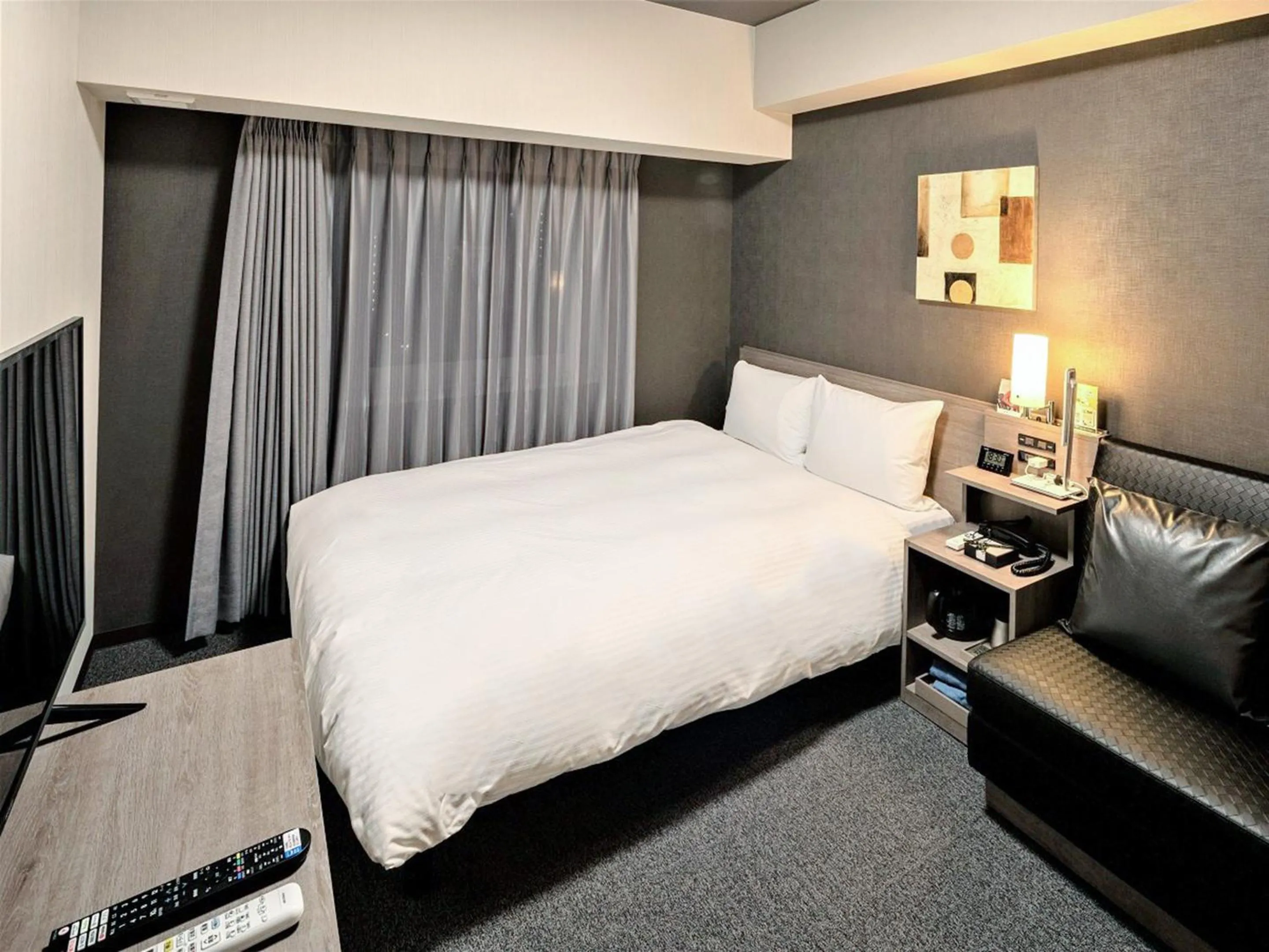 Photo of the whole room, Bed in Hotel Route Inn Matsuyama -Katsuyama Dori-
