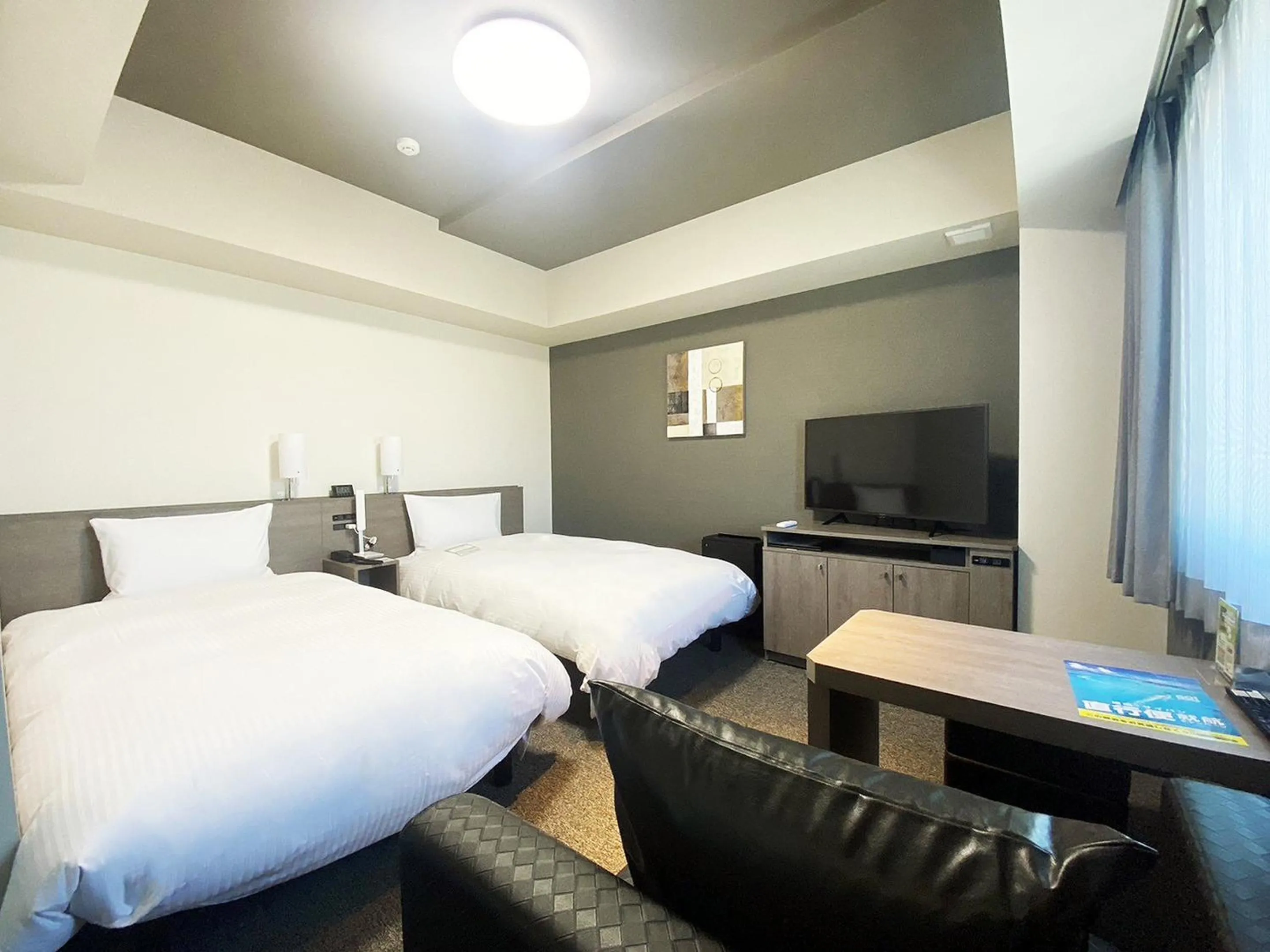 Photo of the whole room, Bed in Hotel Route Inn Matsuyama -Katsuyama Dori-