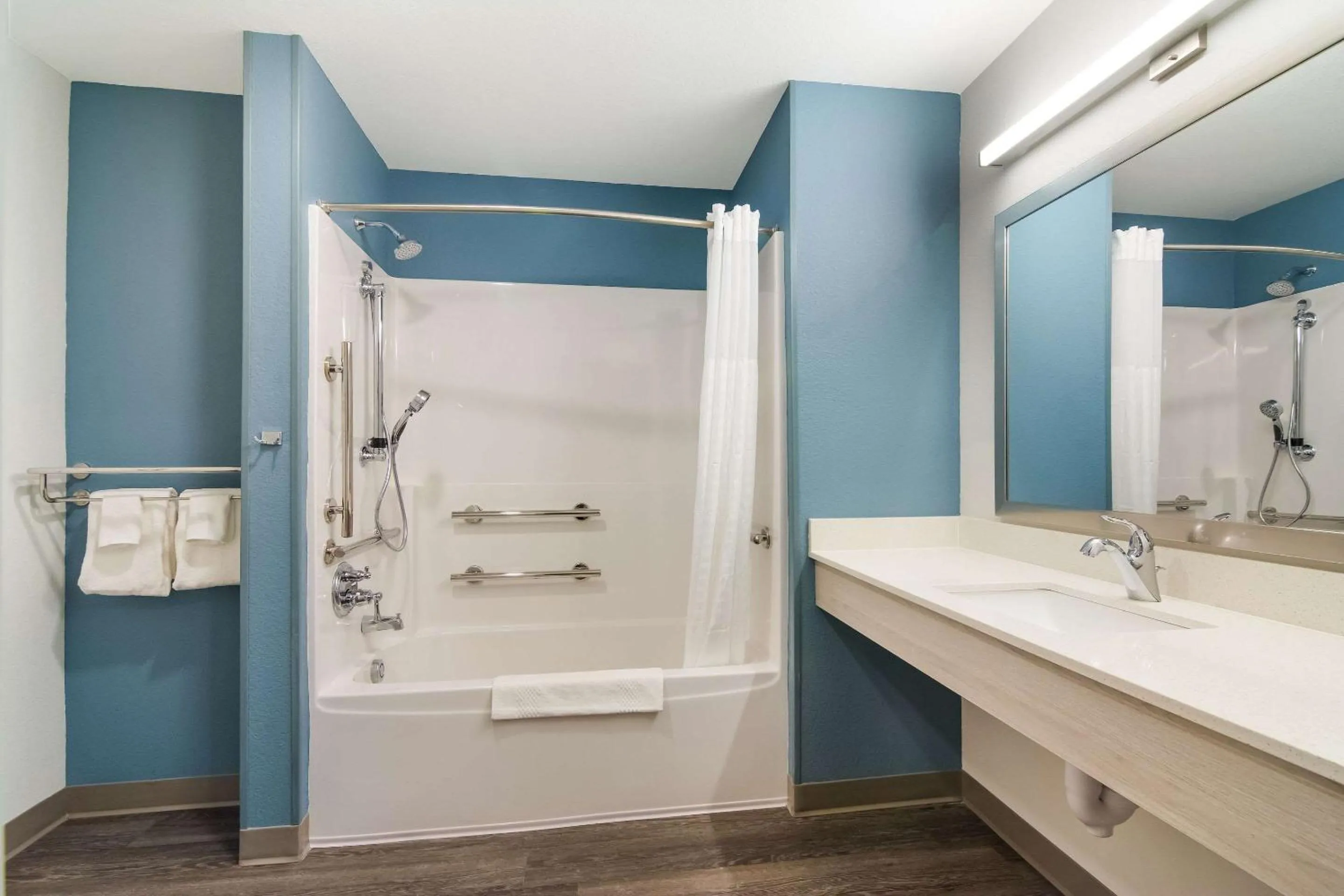 Shower in WoodSpring Suites Morrisville - Raleigh Durham Airport