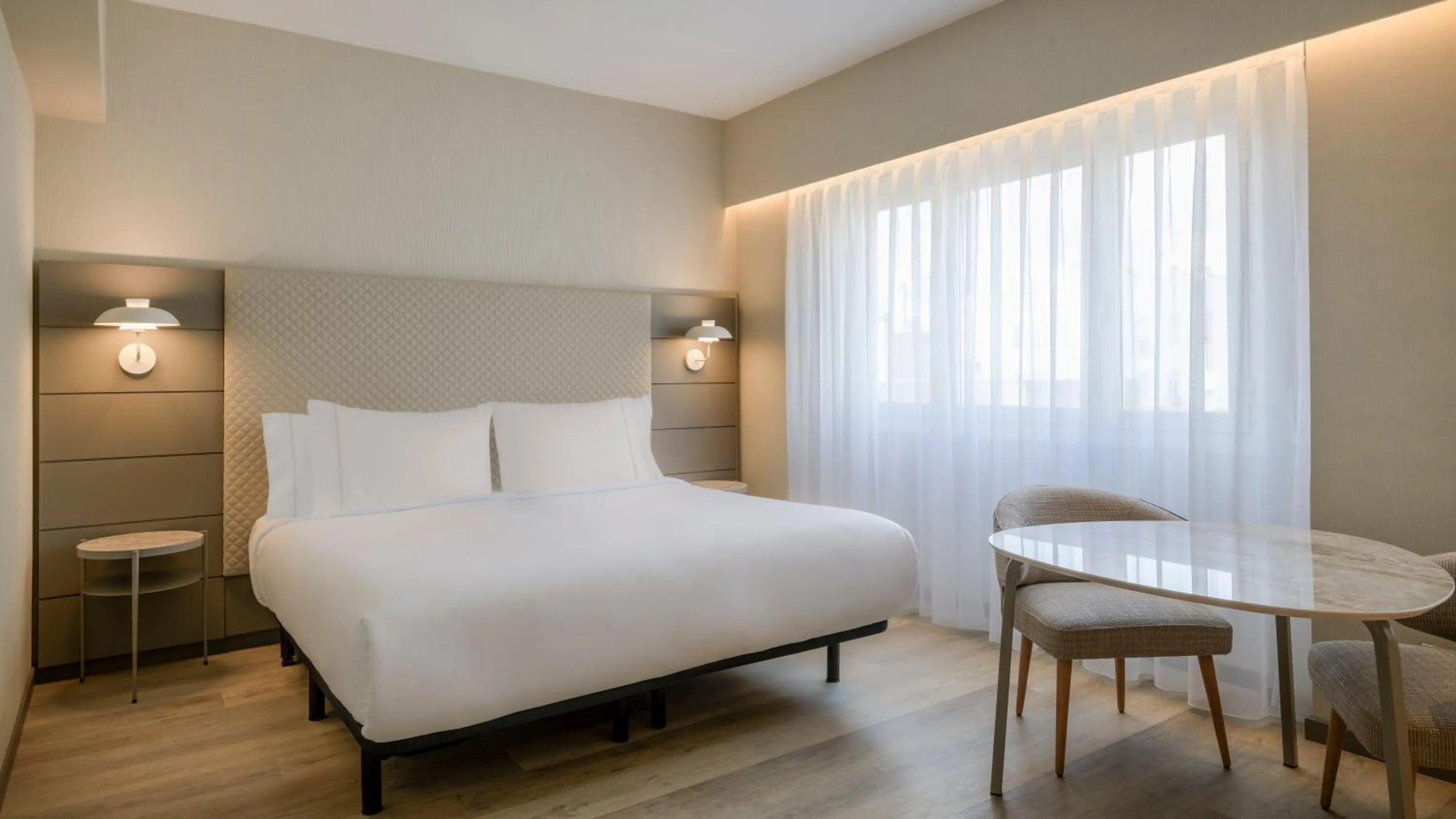 Bed in AC Hotel Carlton Madrid by Marriott