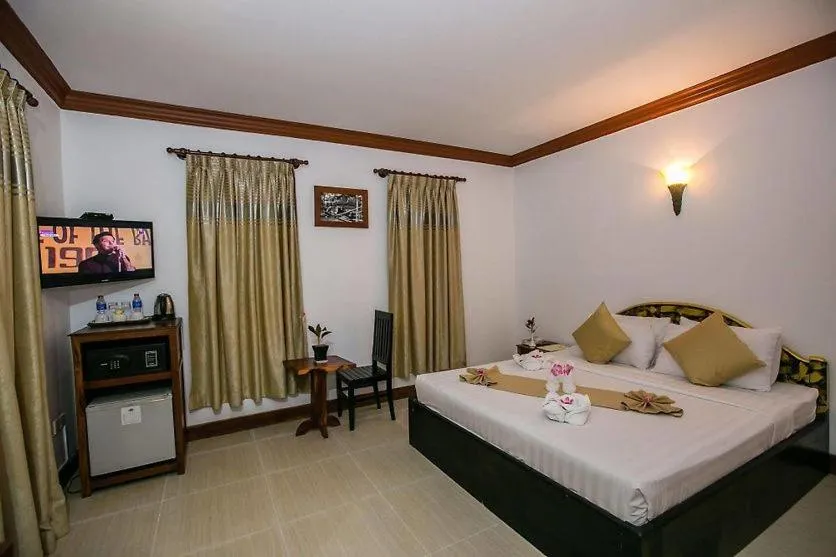 Photo of the whole room, Bed in Angkor Leap Hotel