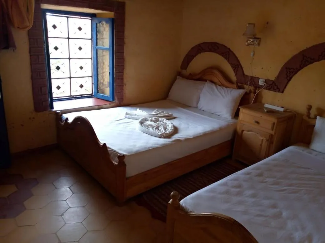 Bed in Les Pyramides Hotel Merzouga