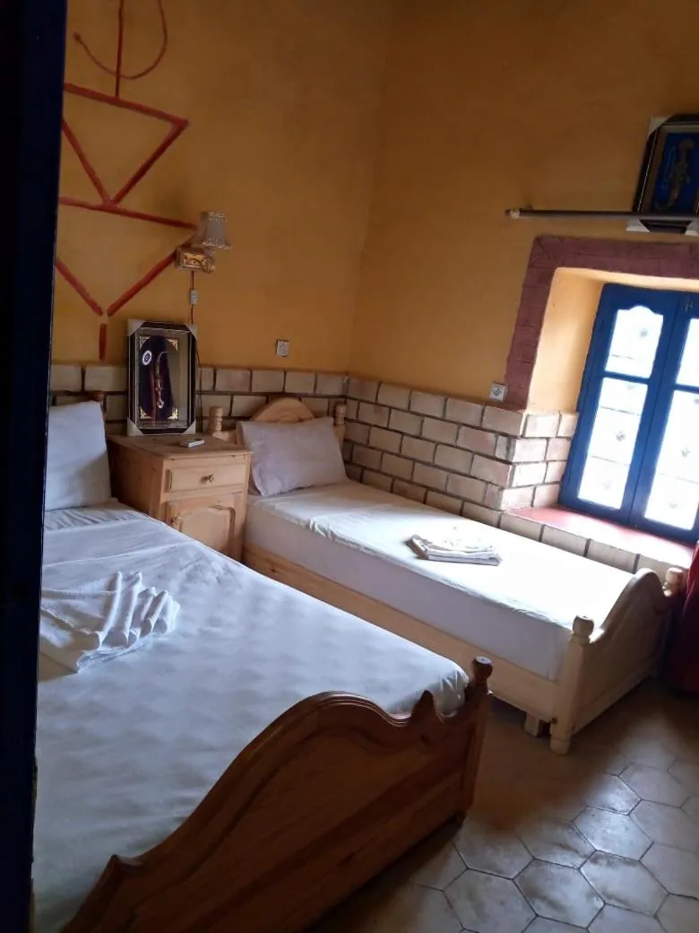 Bed in Les Pyramides Hotel Merzouga